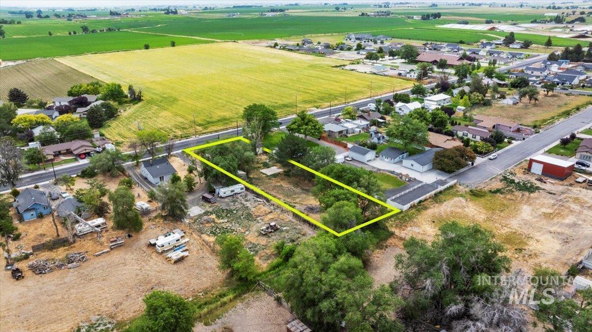 Overview of rural landscape featuring property parcel outlined and extensive farmland