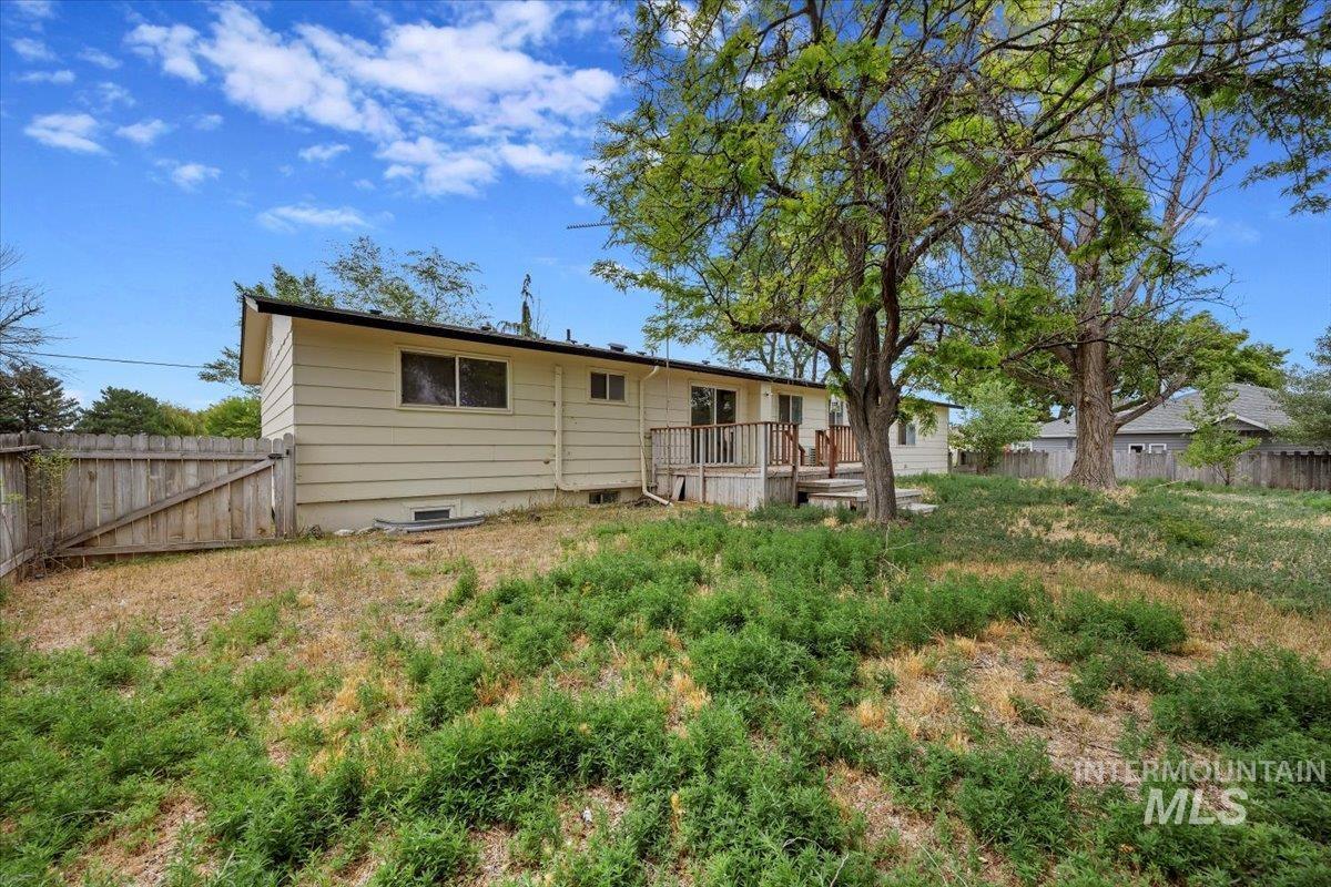 Back of property with a deck