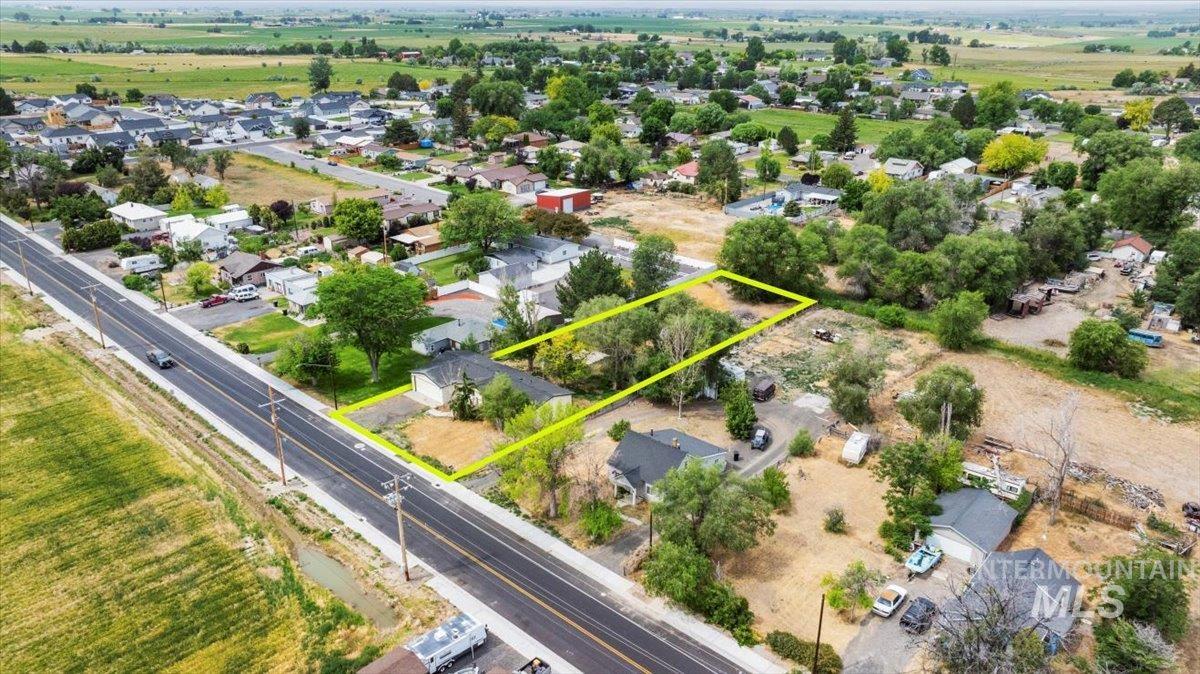 Aerial view of residential area featuring property boundaries highlighted
