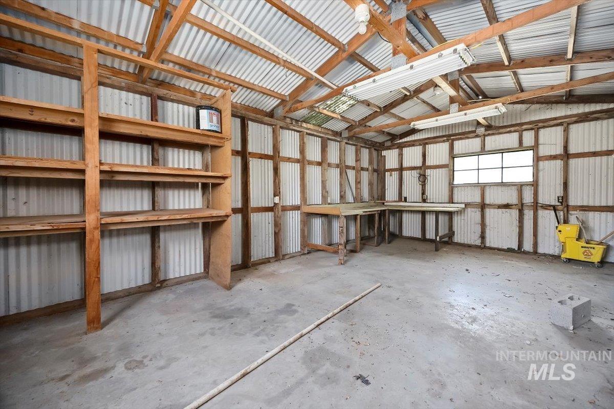 Garage featuring metal wall