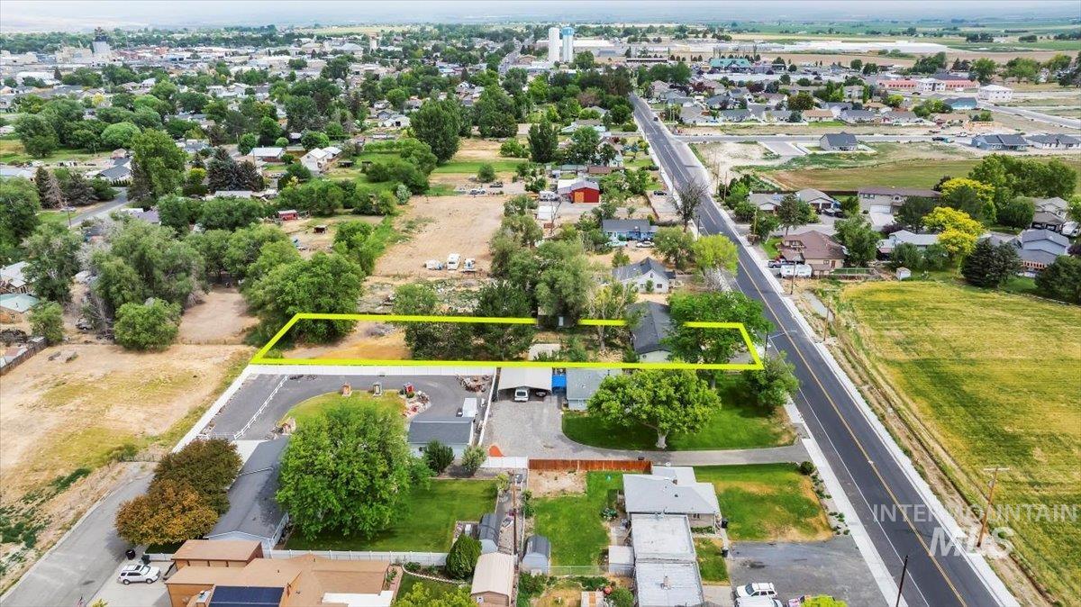 Aerial perspective of suburban area with property parcel outlined