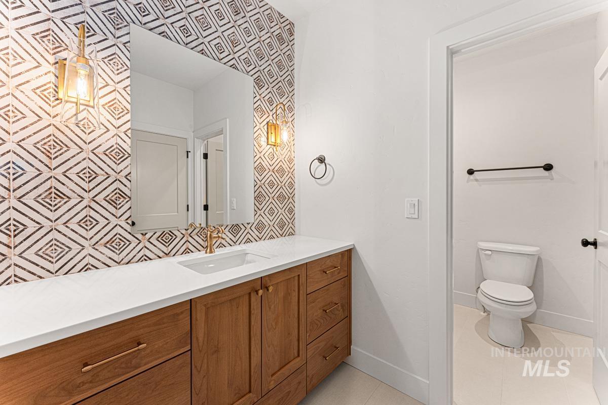 Bathroom with vanity and light tile patterned floors