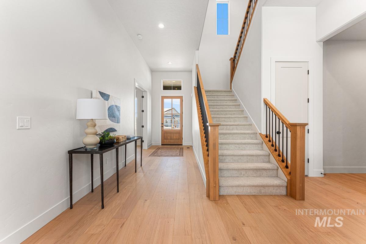 Foyer featuring light wood finished floors and recessed lighting