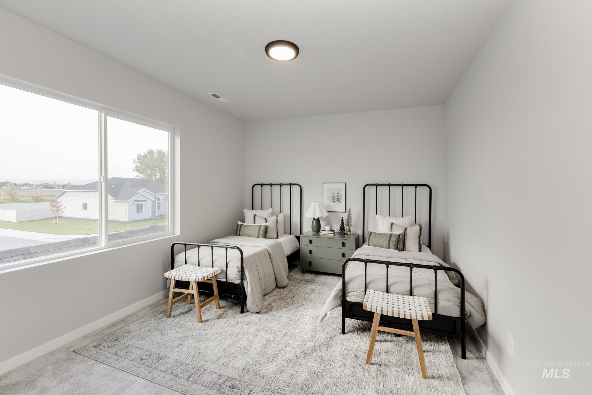 Carpeted bedroom with baseboards
