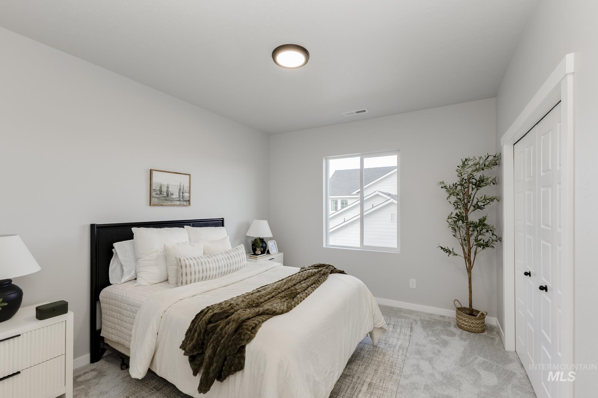Bedroom featuring carpet floors and a closet
