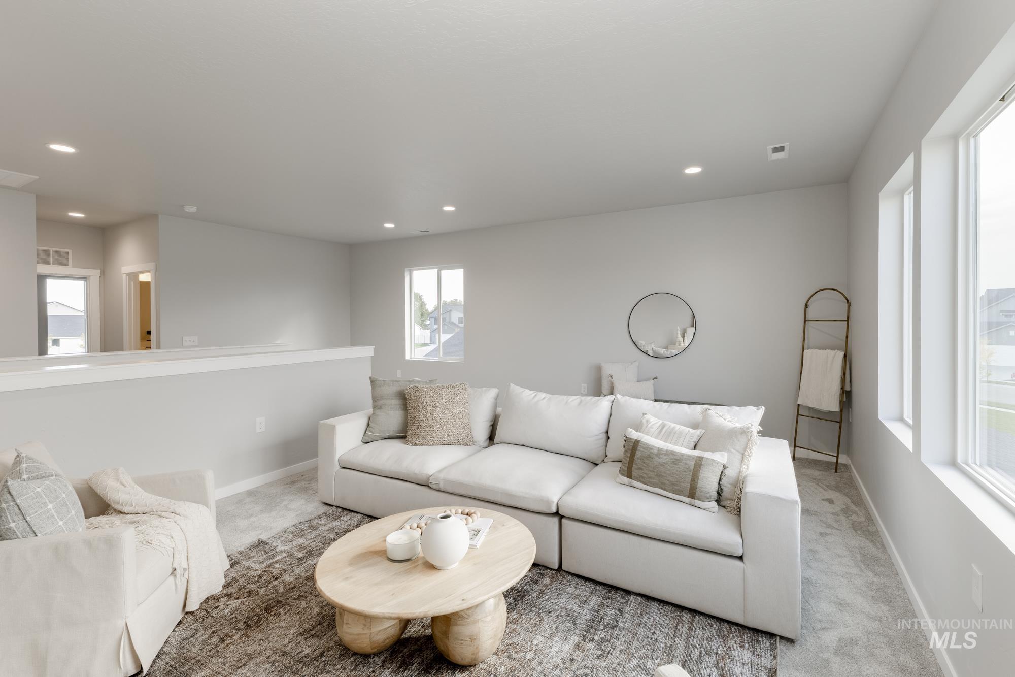 Living room with carpet floors and recessed lighting