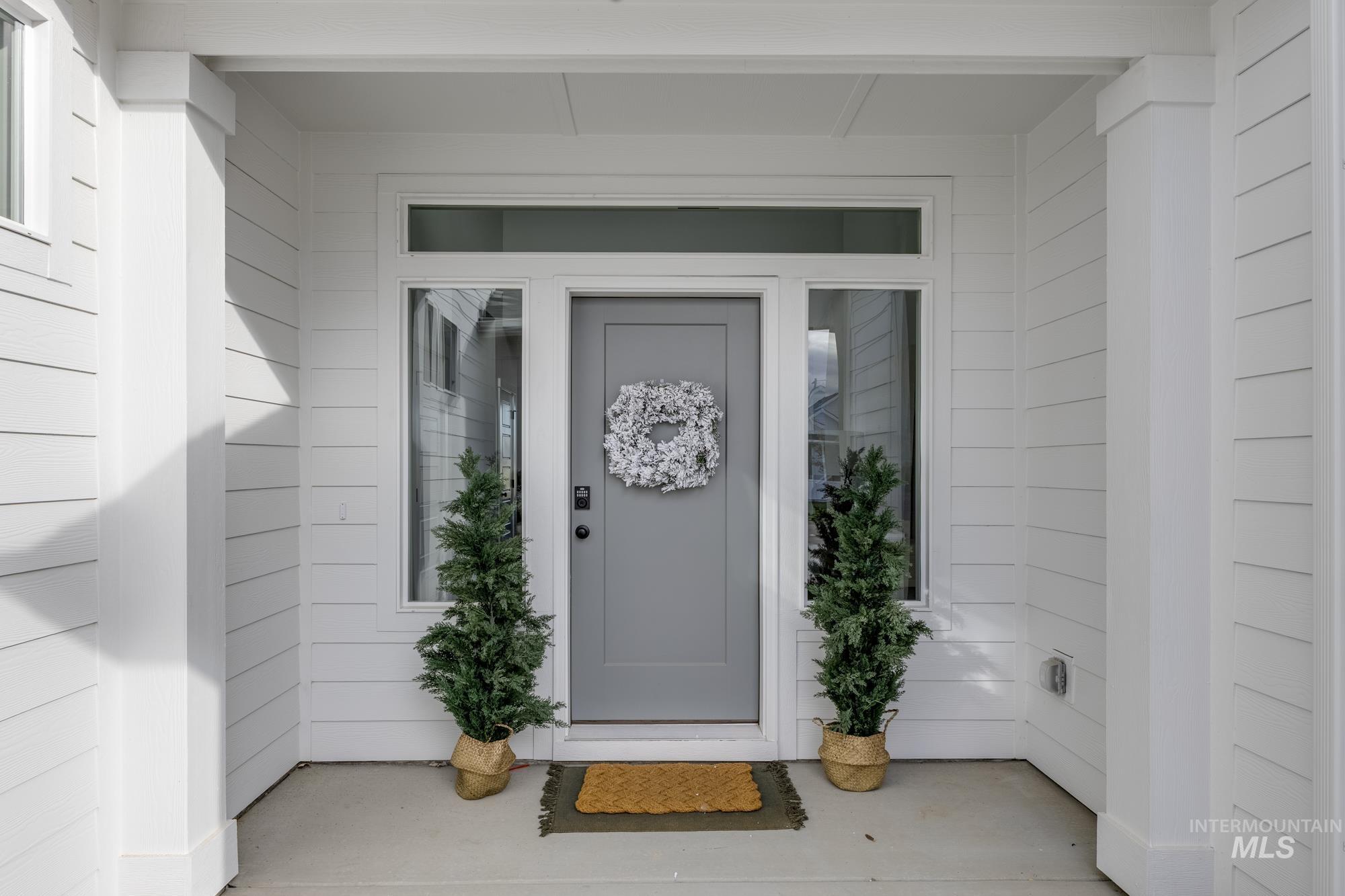 Doorway to property featuring a porch