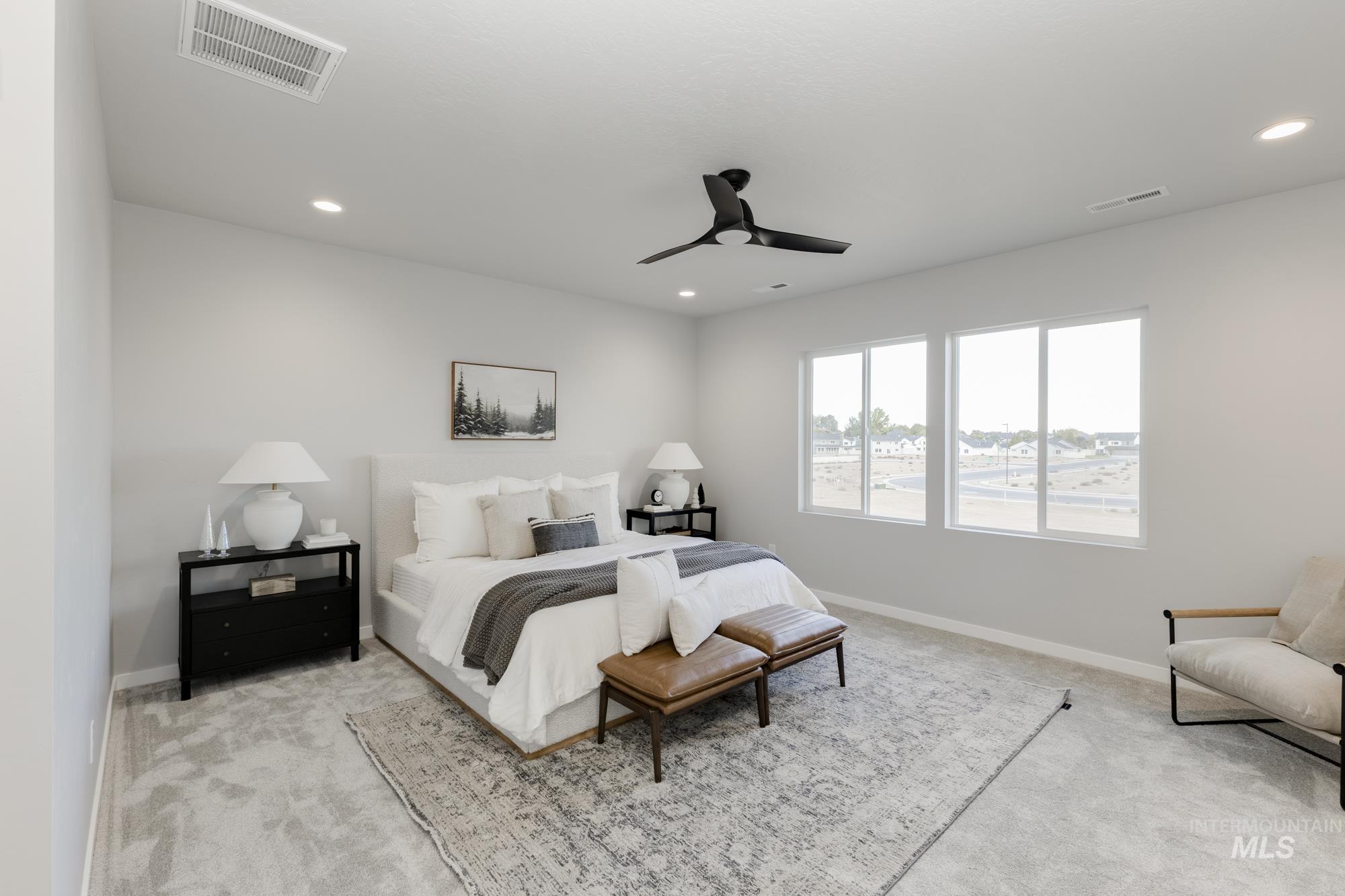Bedroom featuring light carpet, a ceiling fan, and recessed lighting