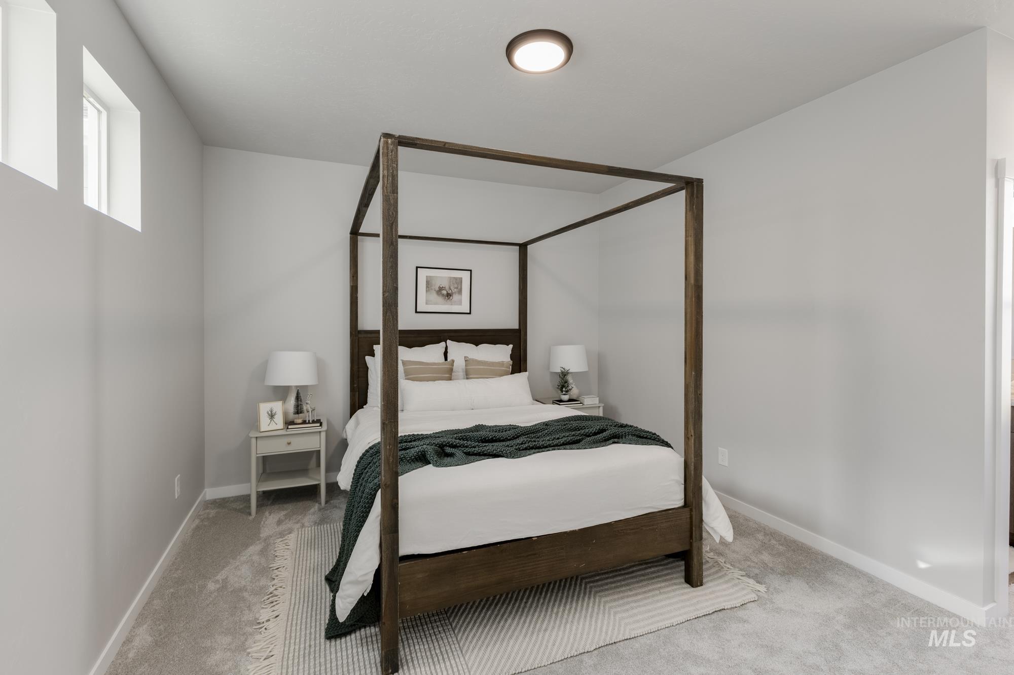 Carpeted bedroom featuring baseboards