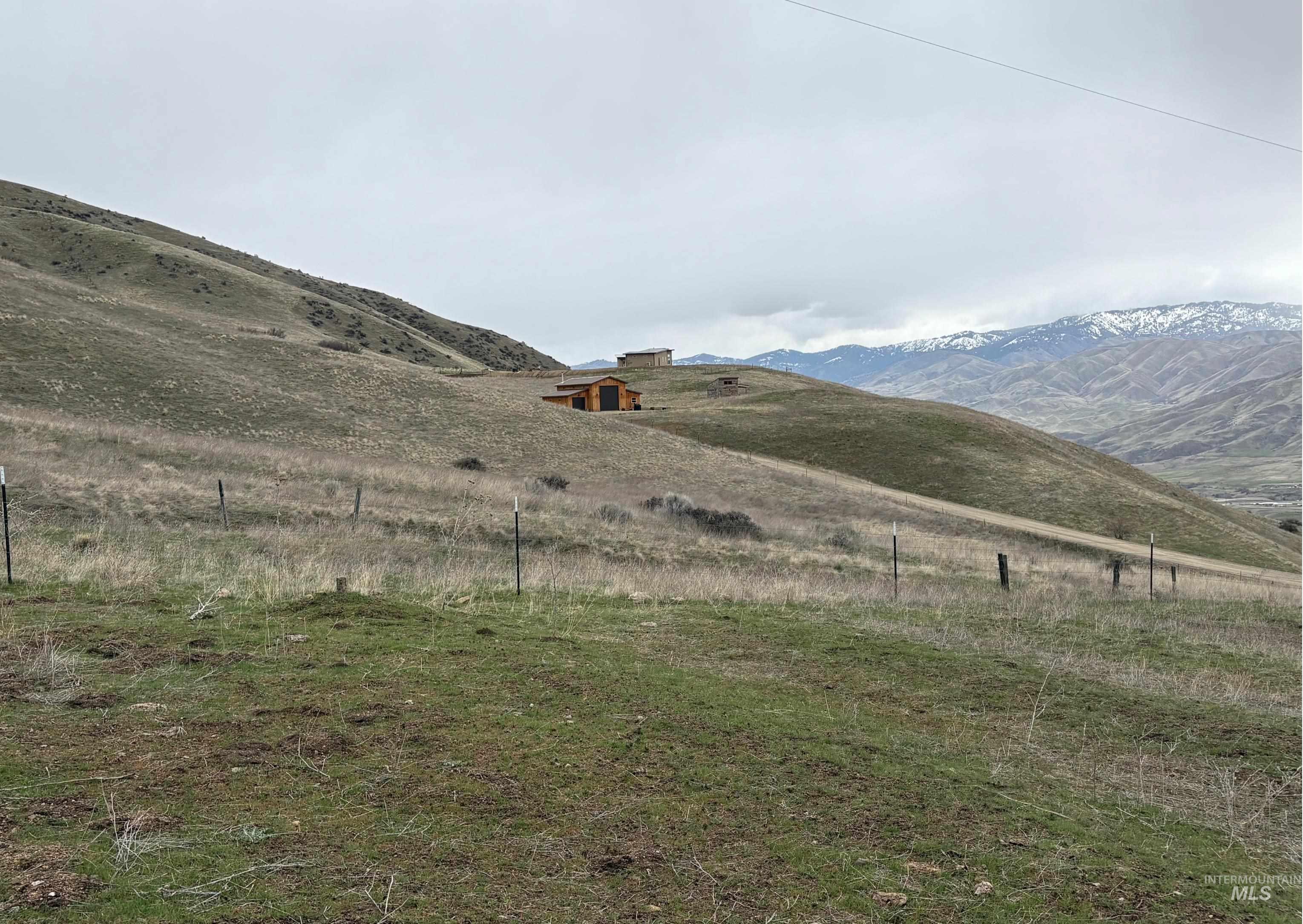 View of mountain backdrop with rural landscape