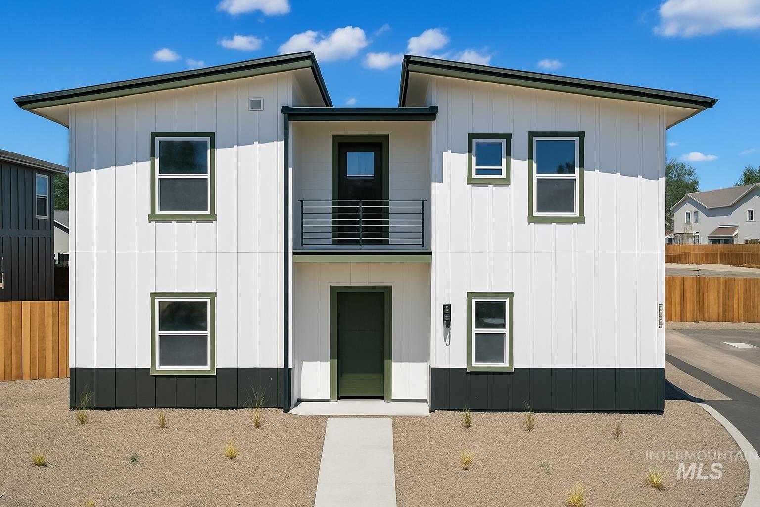 View of front of property featuring a balcony