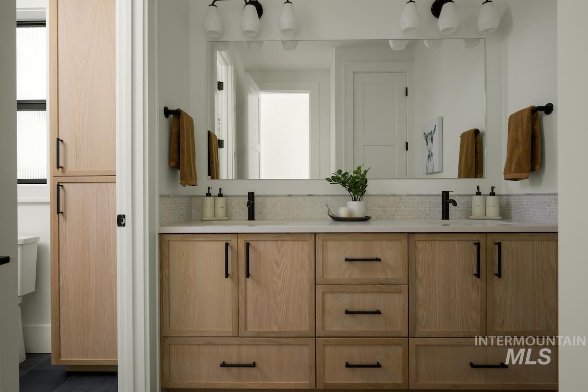 Bathroom featuring double vanity
