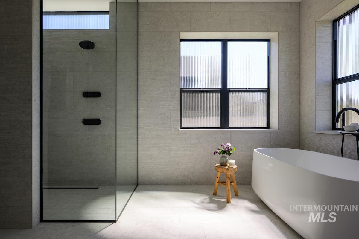 Bathroom with a walk in shower and a soaking tub