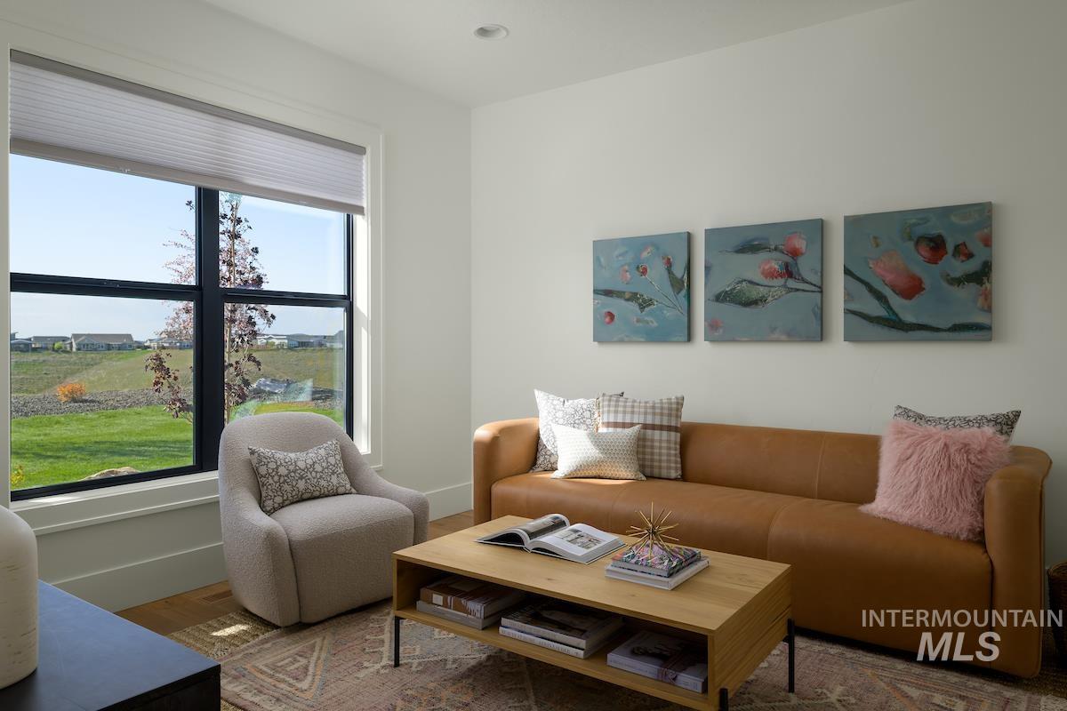 Living room featuring baseboards and wood finished floors