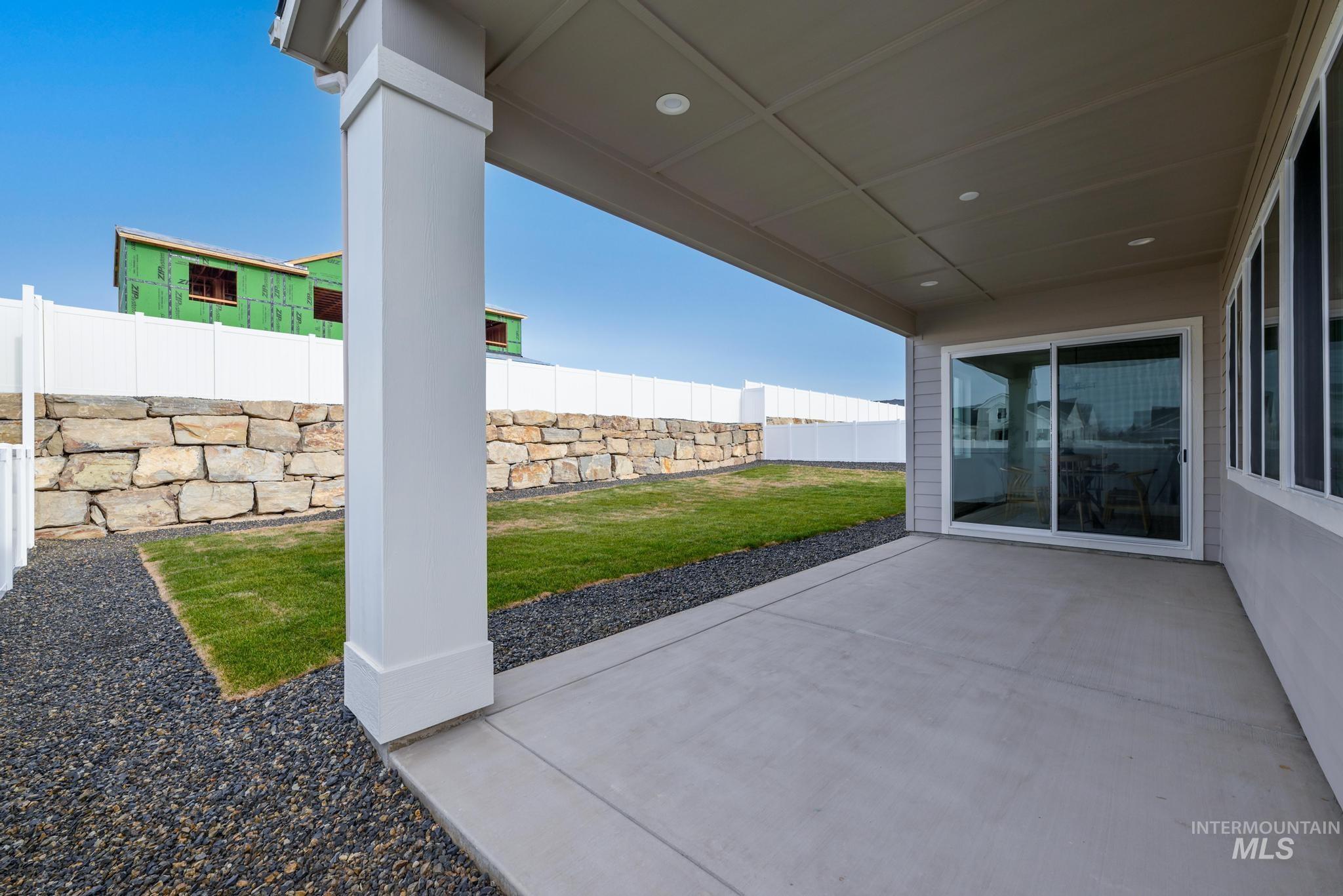 Fenced backyard featuring a patio area