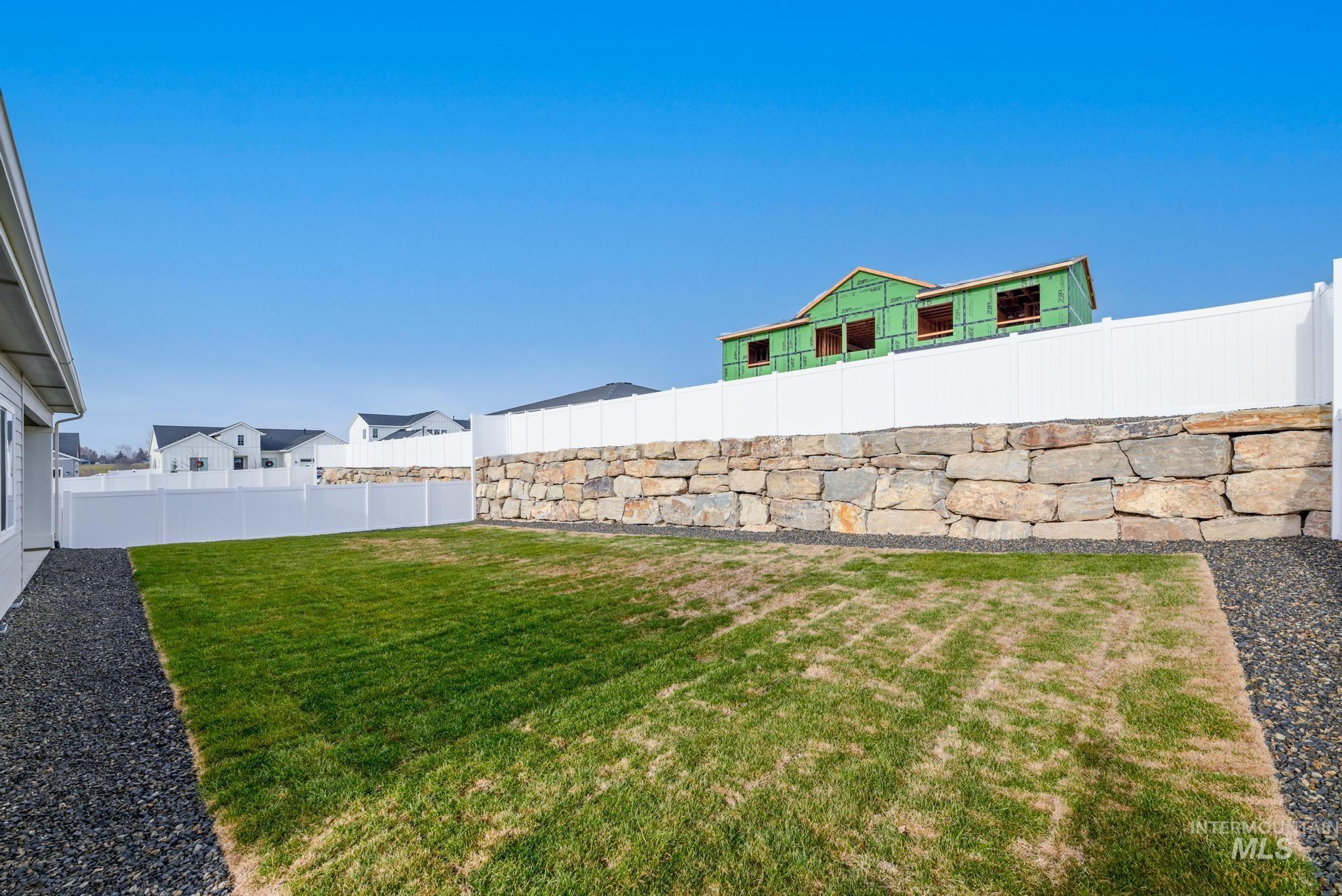 View of fenced backyard