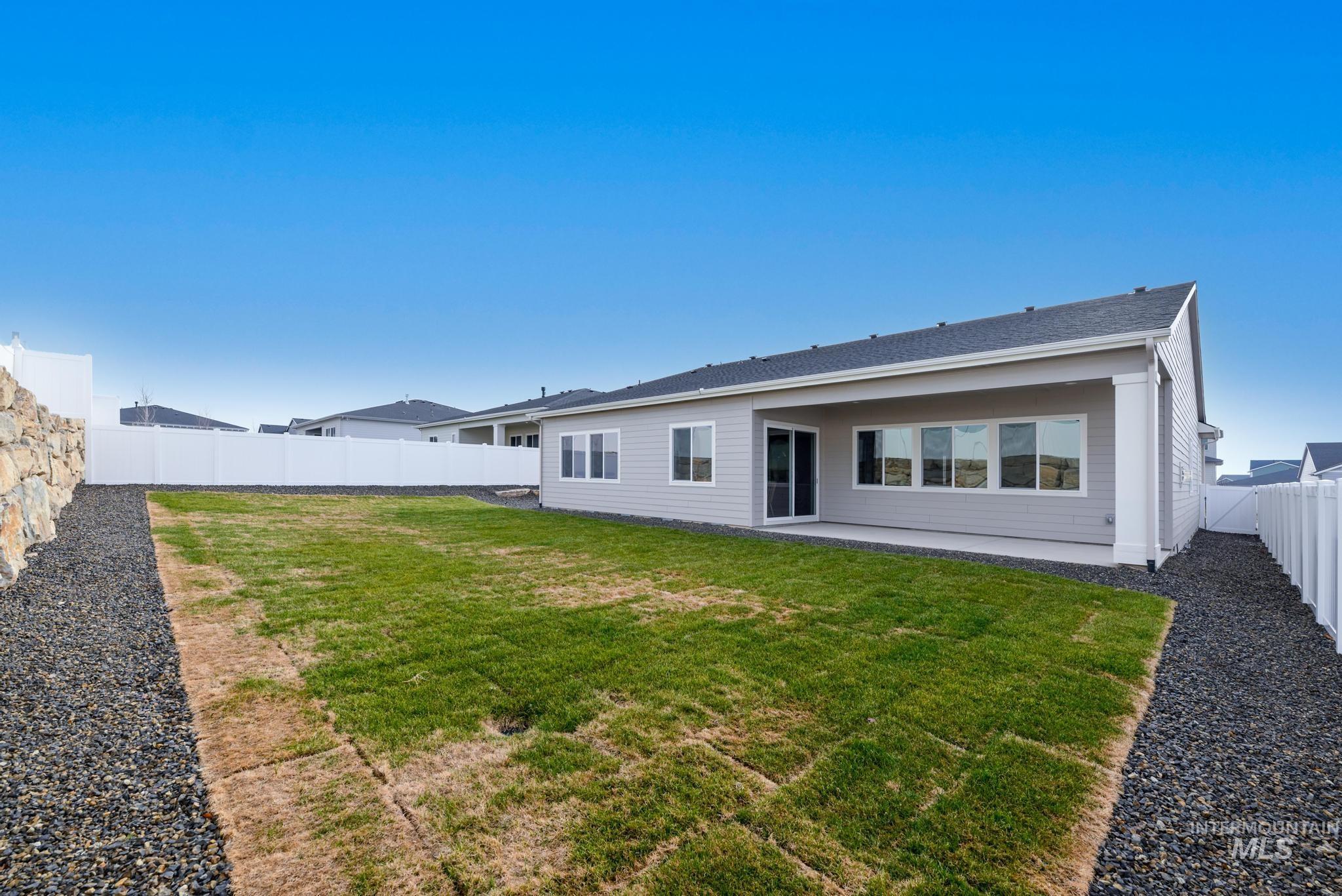 Back of house featuring a patio and a fenced backyard