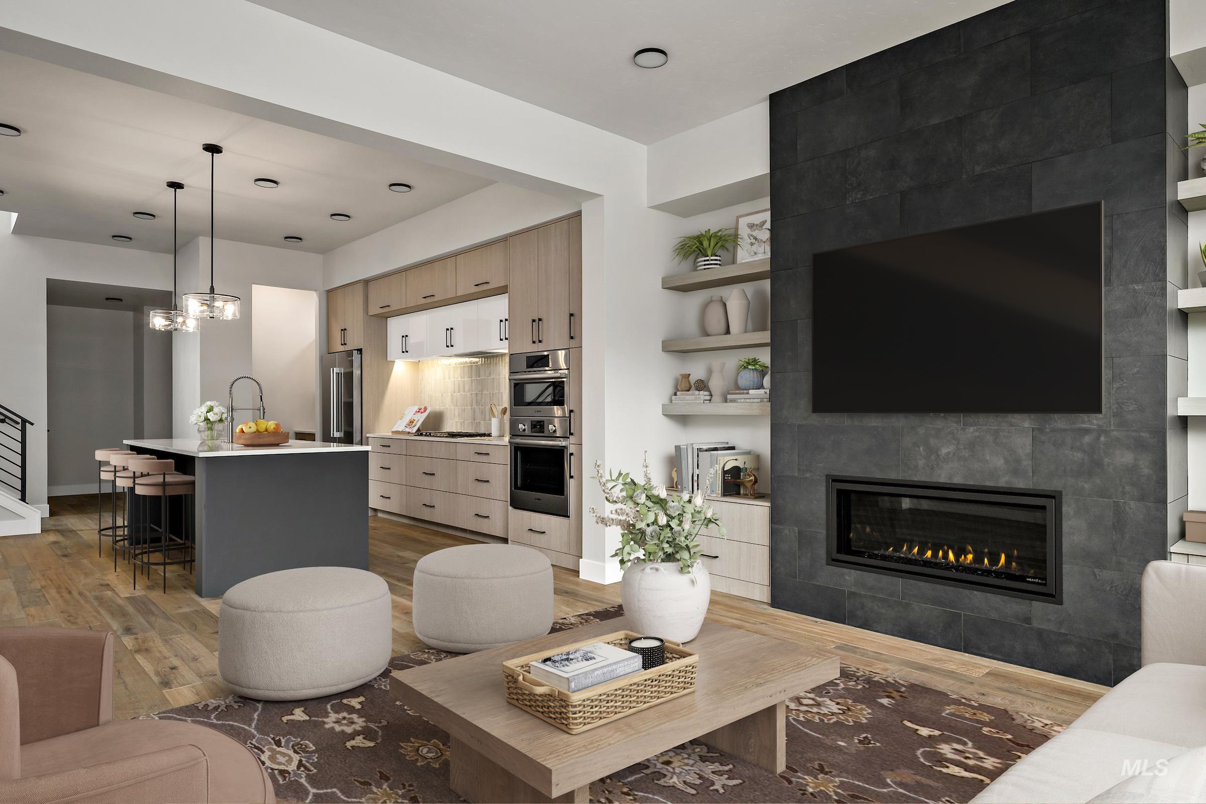 Living room with a fireplace and light wood-type flooring