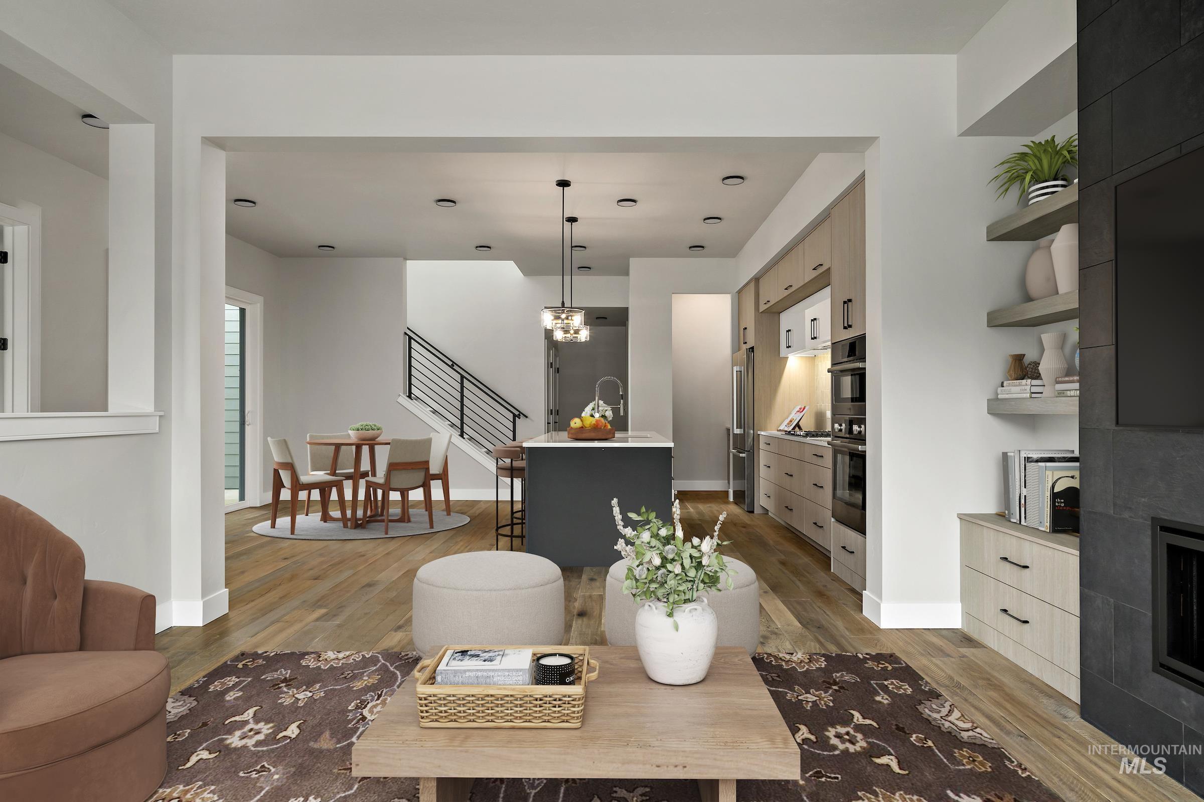Living room featuring stairs and light wood-style floors