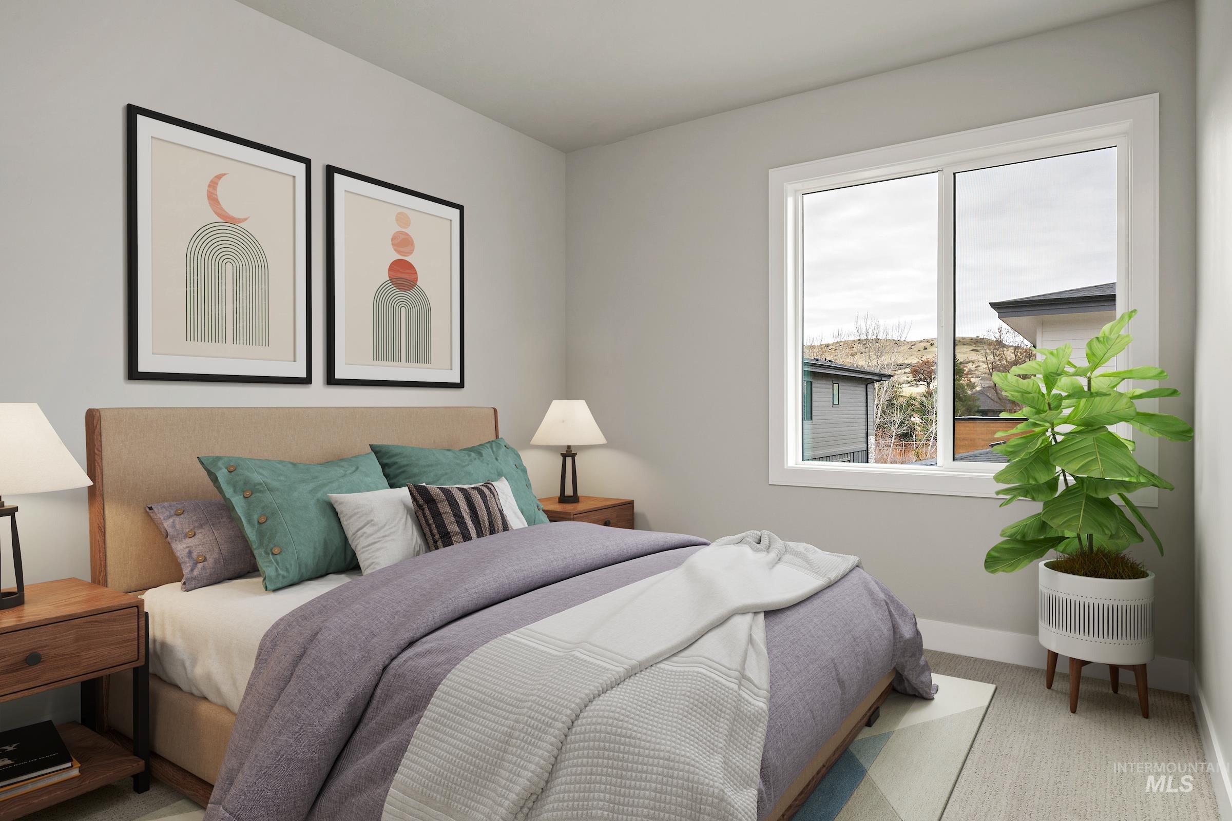 Bedroom featuring light carpet and baseboards