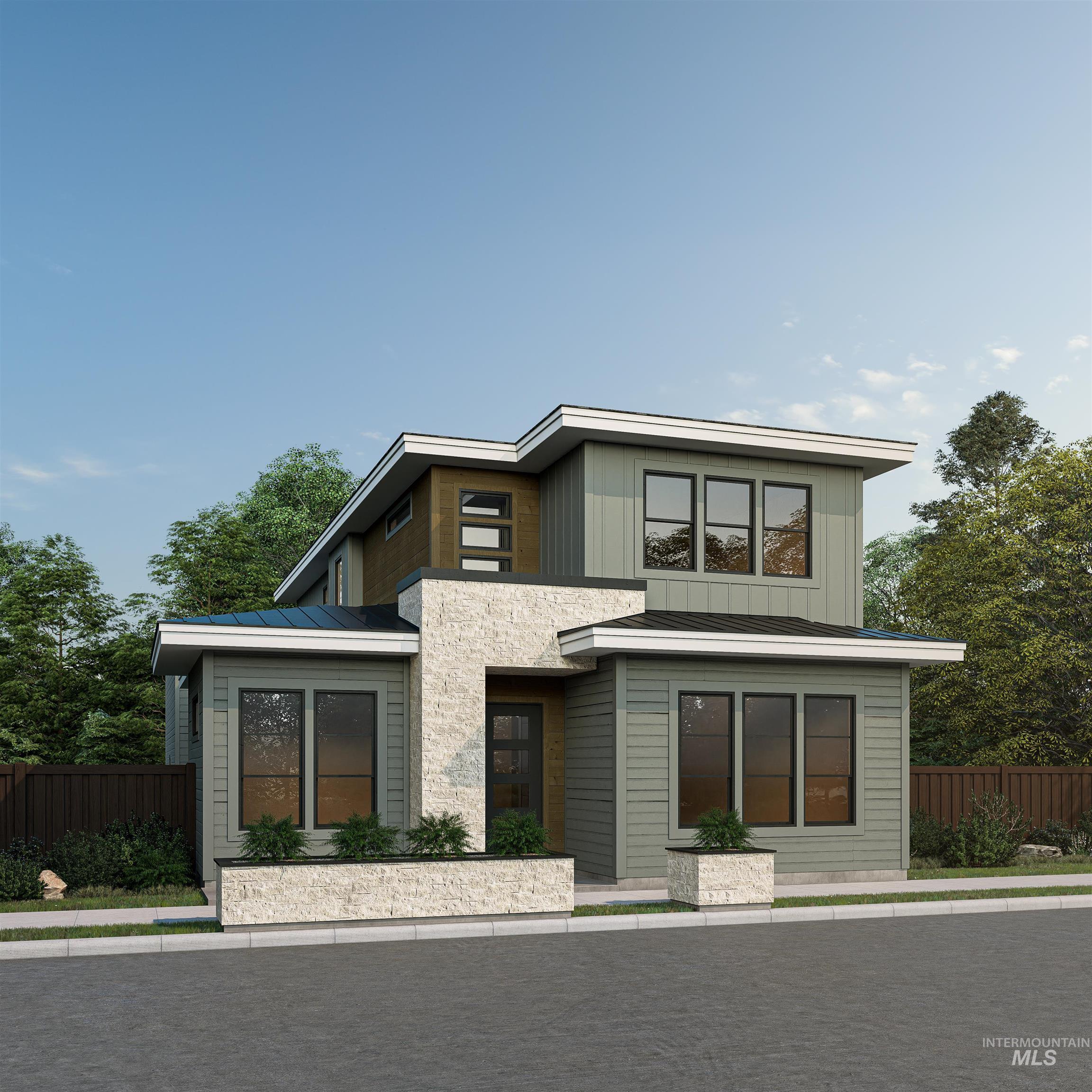 View of front of home featuring a metal roof, board and batten siding, and a standing seam roof