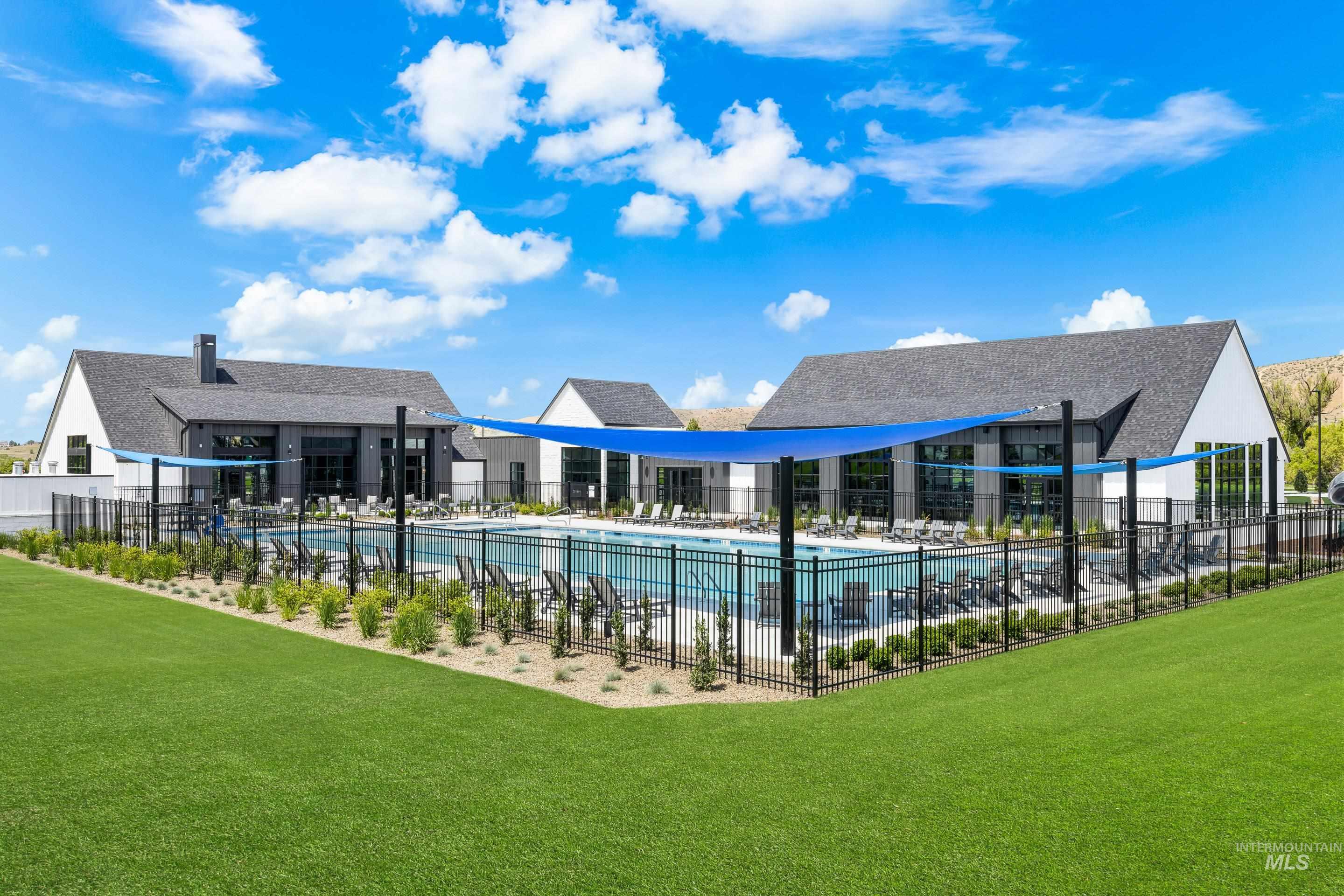 Community pool with a patio