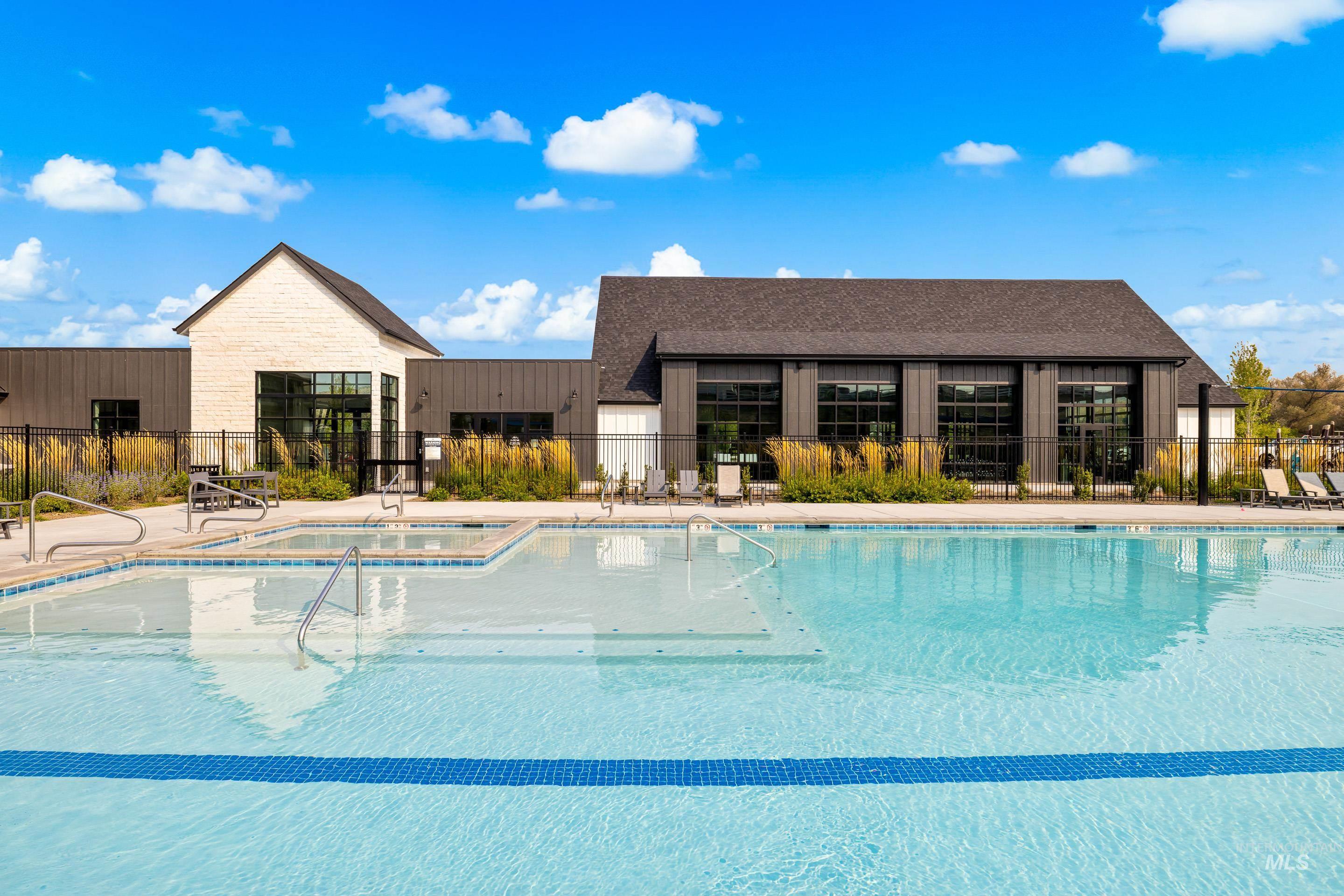 Community pool featuring a patio