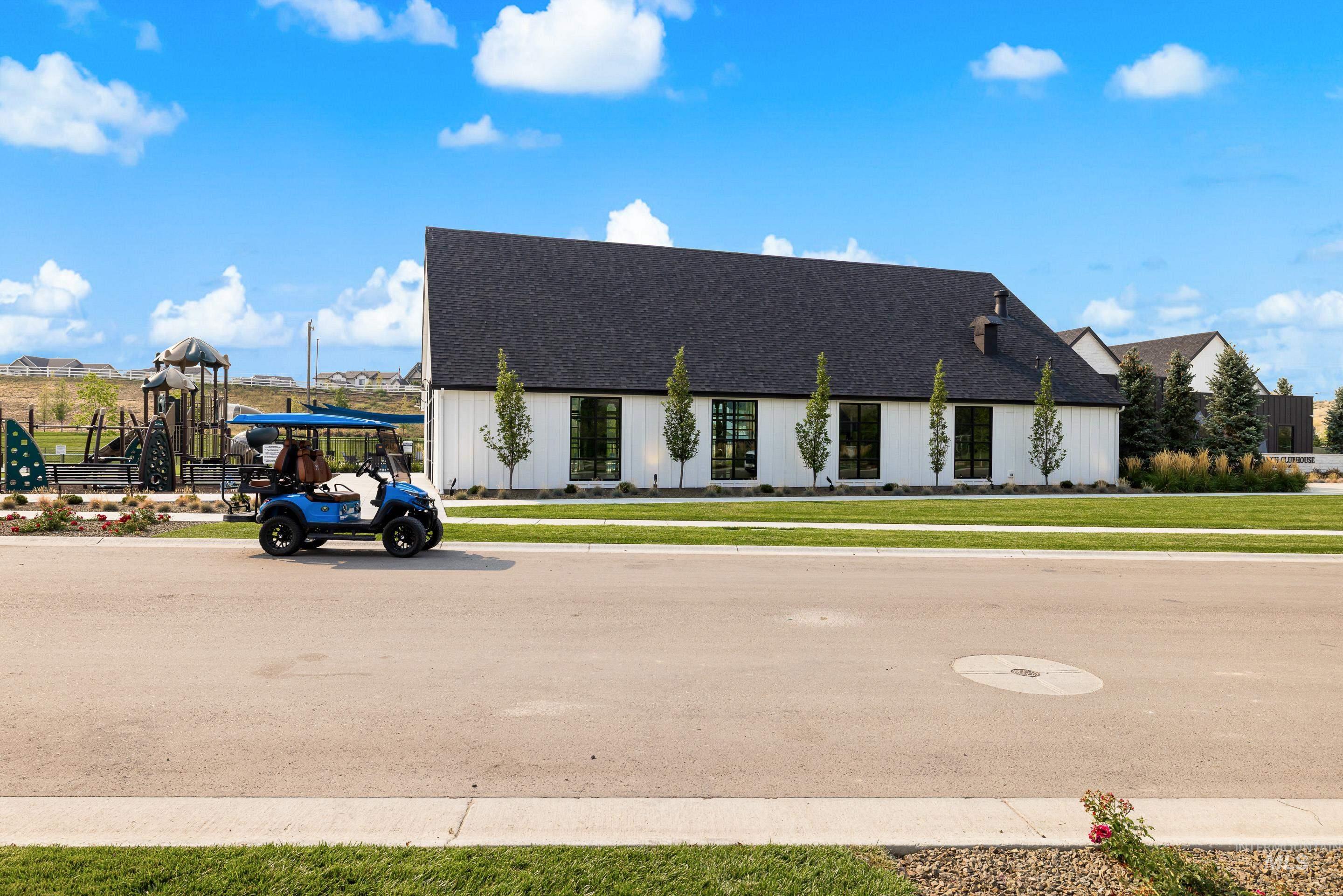View of front of property with roof with shingles and a front lawn