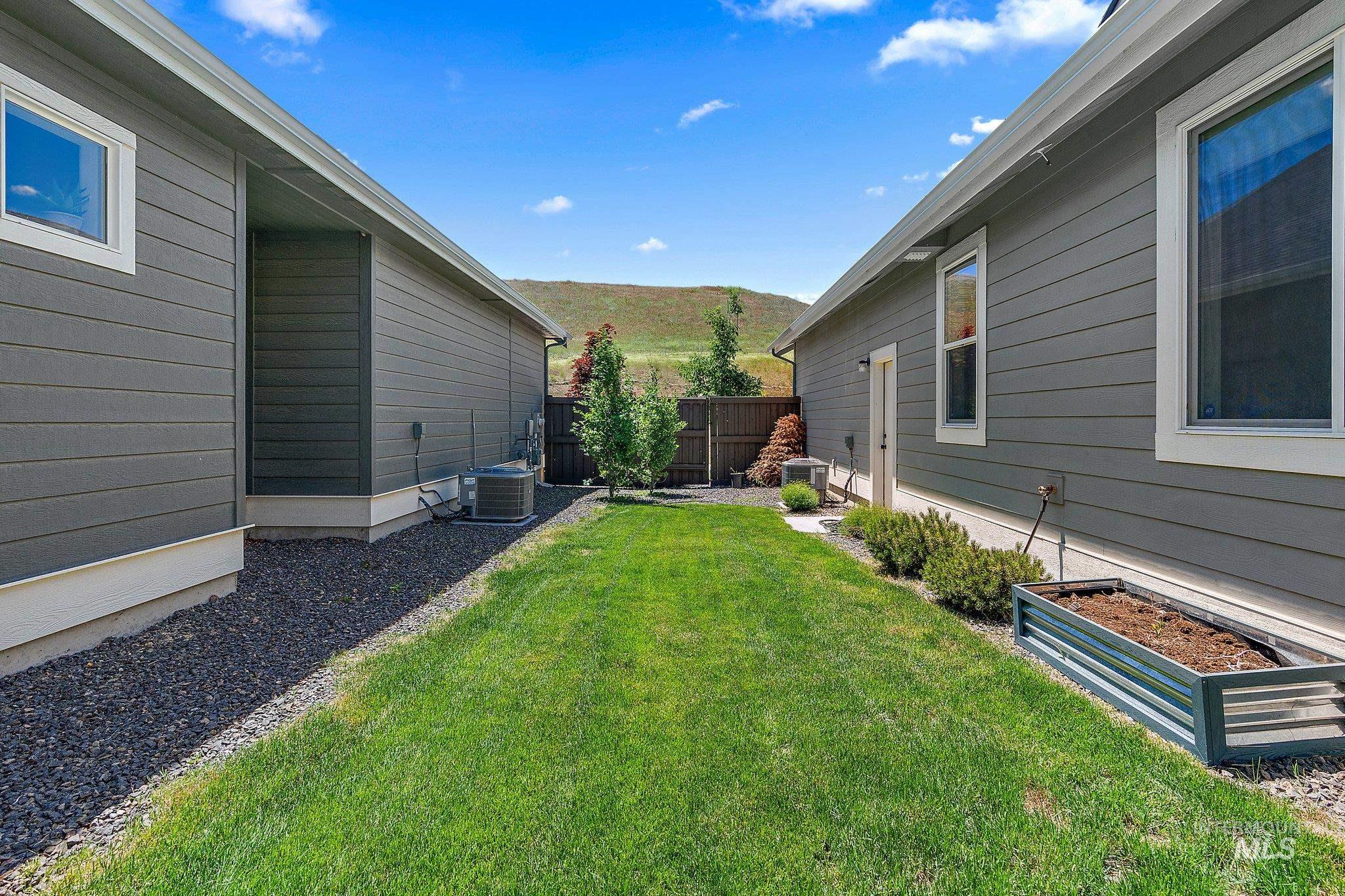 View of yard featuring a mountain view and a vegetable garden