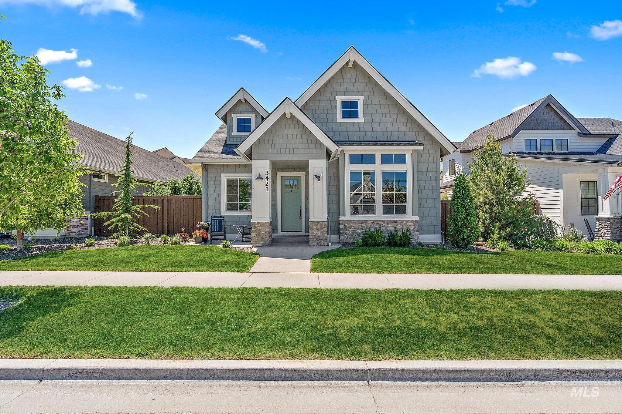 Craftsman inspired home featuring stone siding