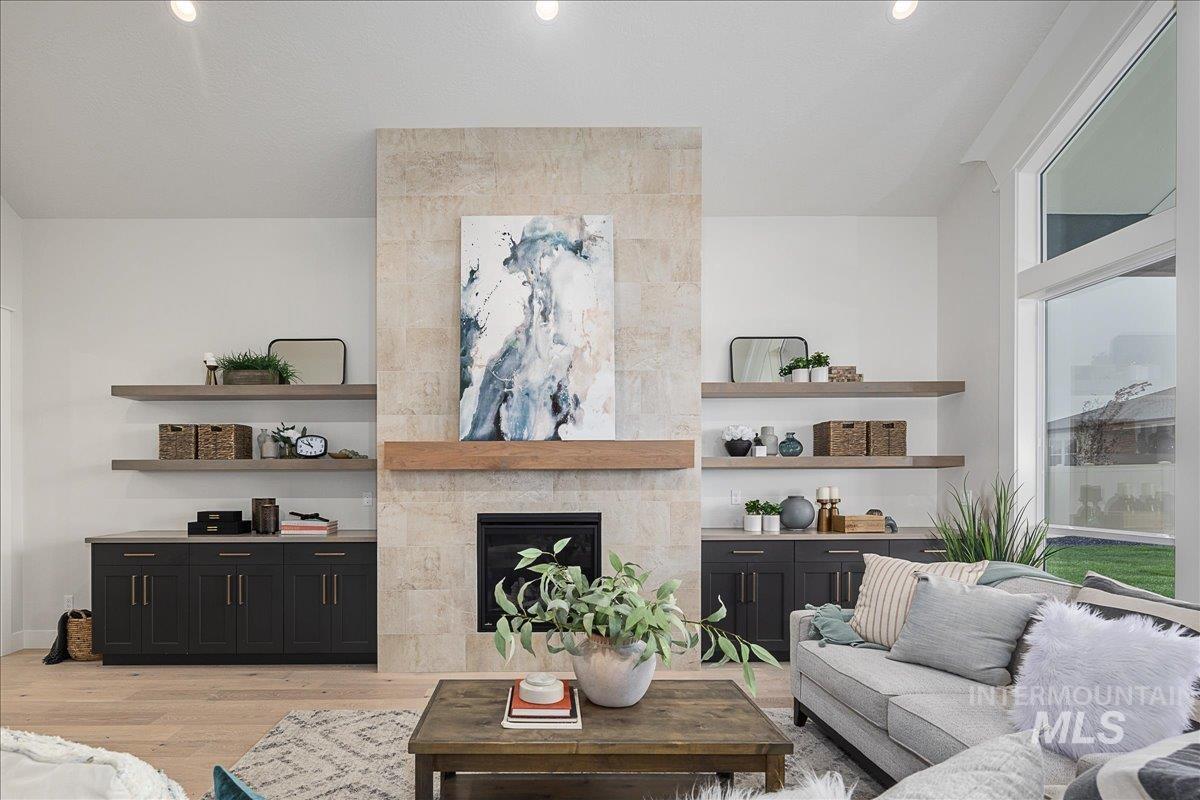Living area featuring a fireplace and light wood-type flooring
