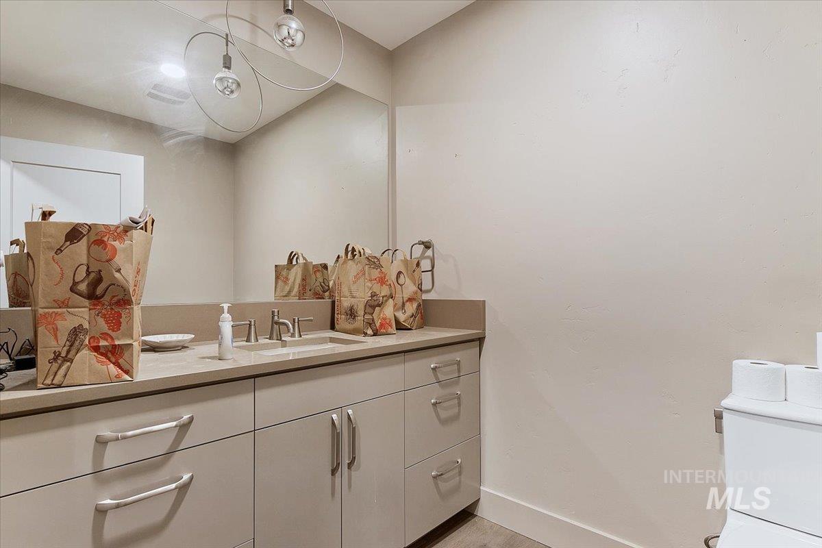 Bathroom with vanity and baseboards