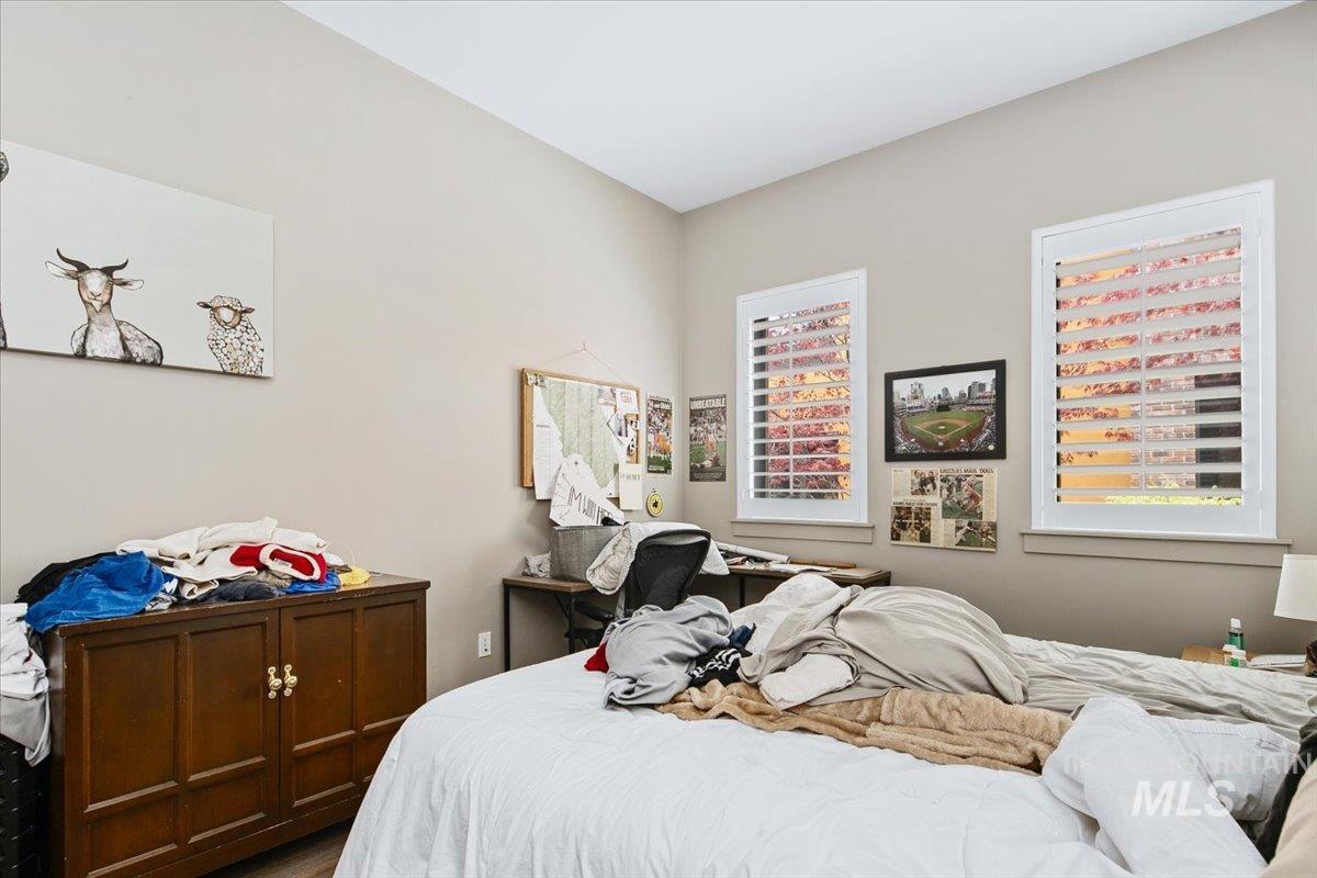 Bedroom with multiple windows