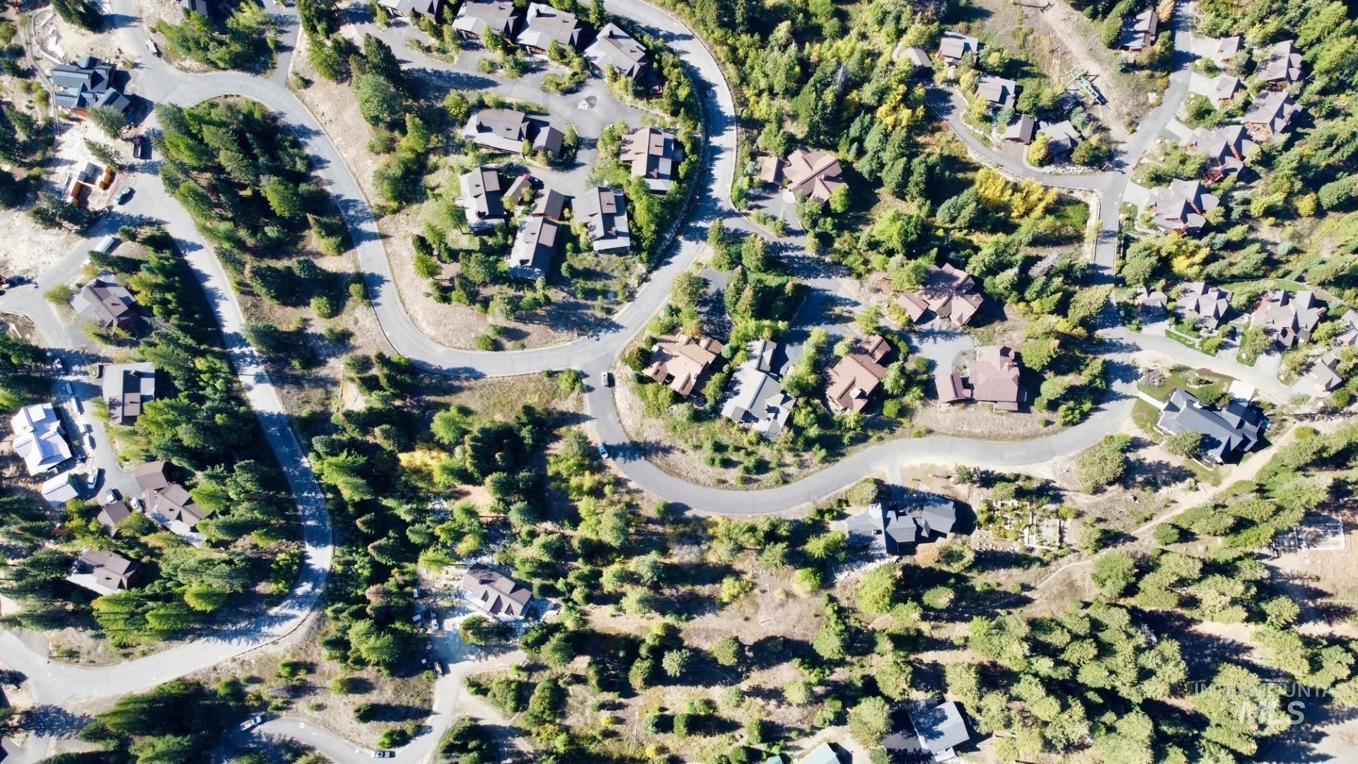 Aerial view of property's location featuring nearby suburban area