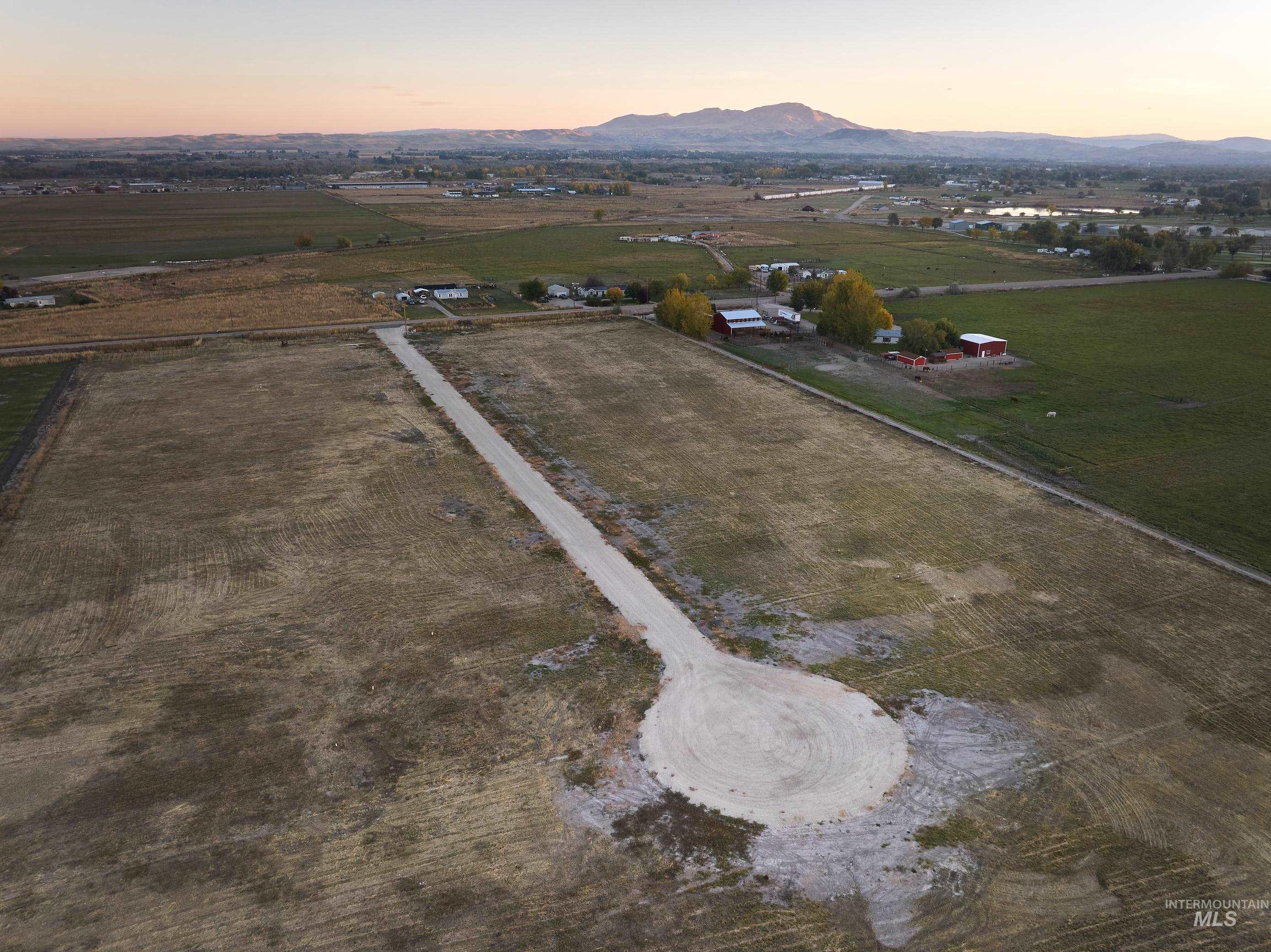 Aerial view at dusk of a view of rural / pastoral area and a mountain view