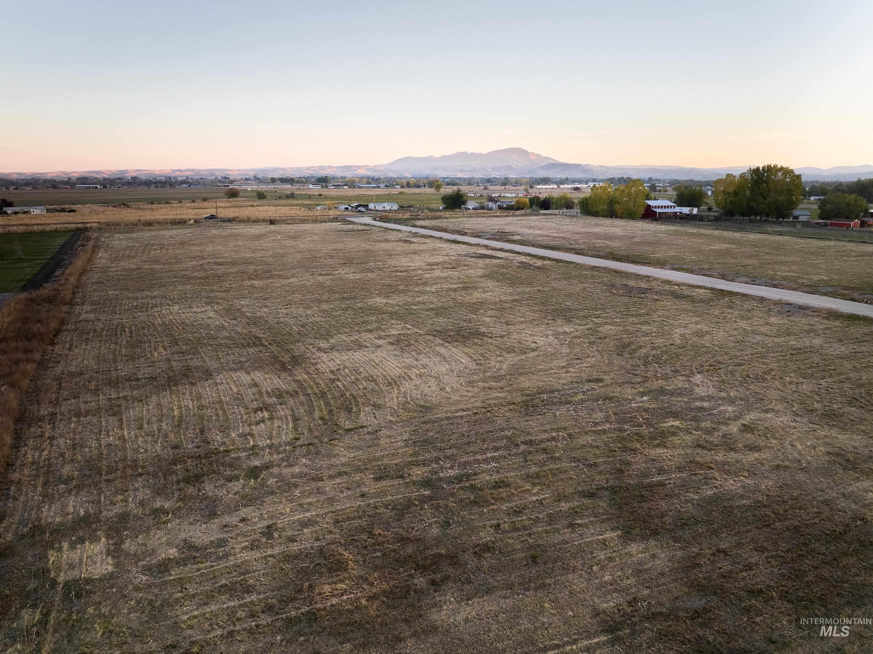 Aerial view at dusk of a mountain view and a rural view