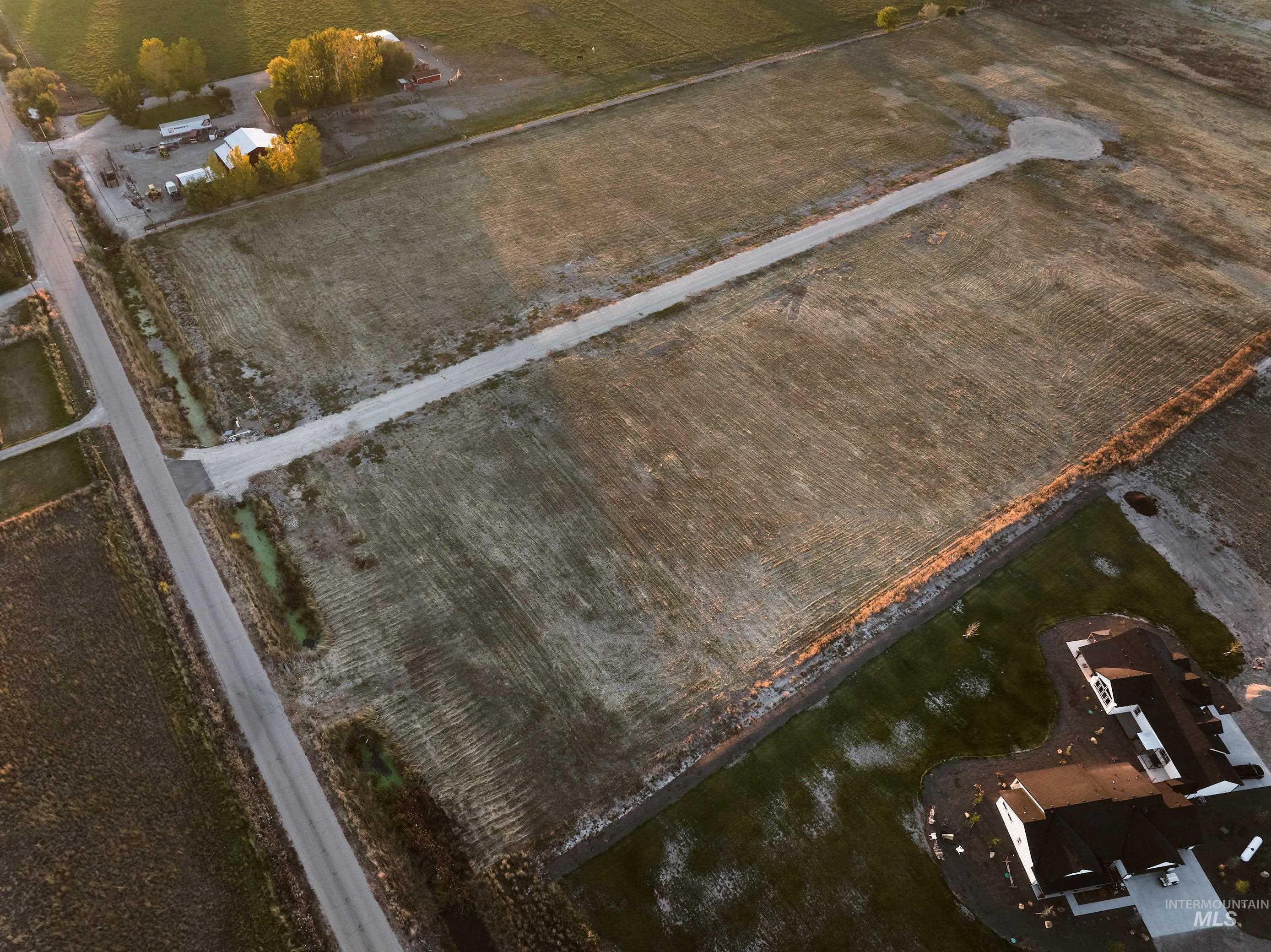 Aerial view of property's location featuring rural landscape and rows of crops