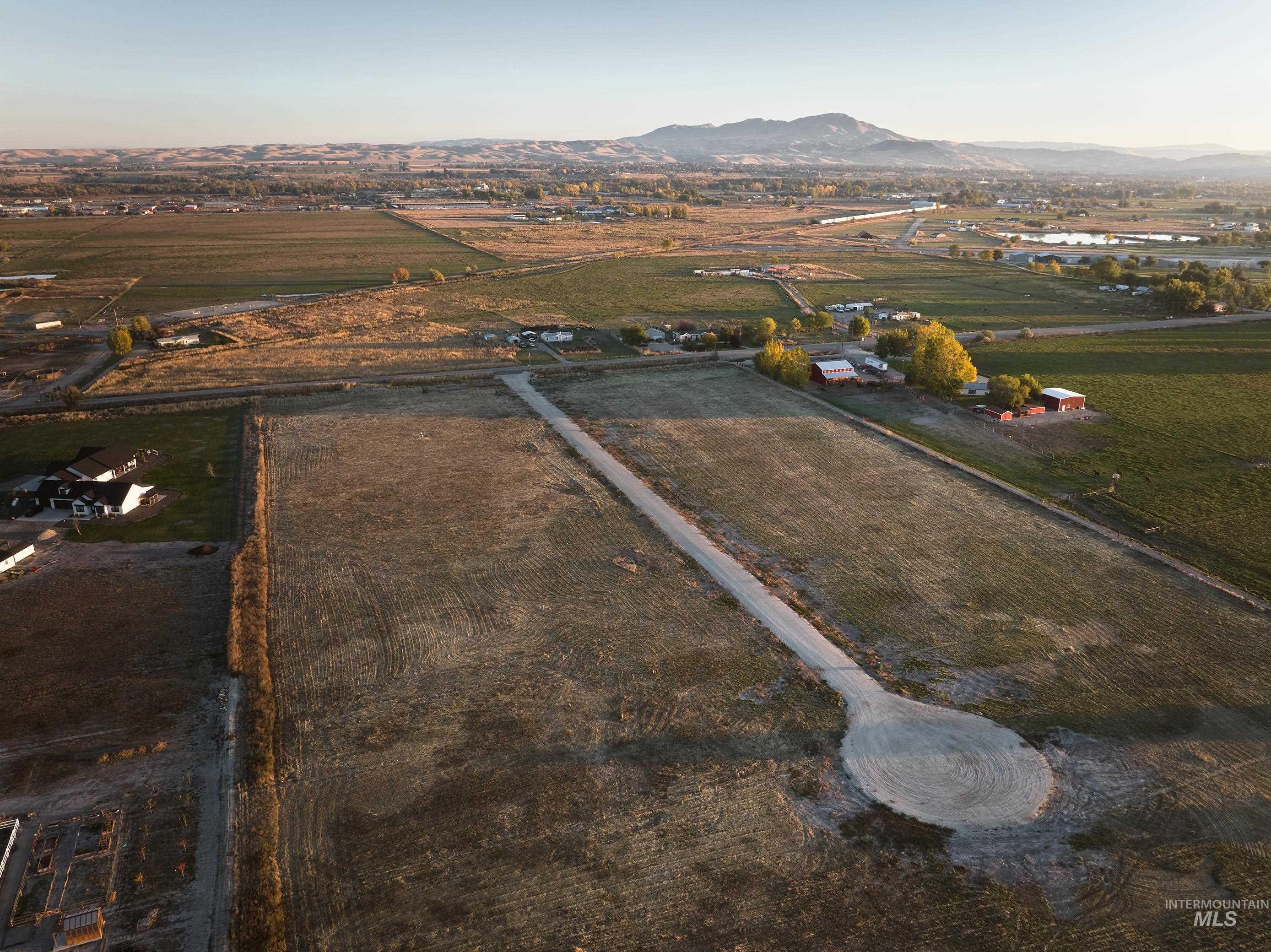 View of property location with rural landscape, mountains, and extensive farmland
