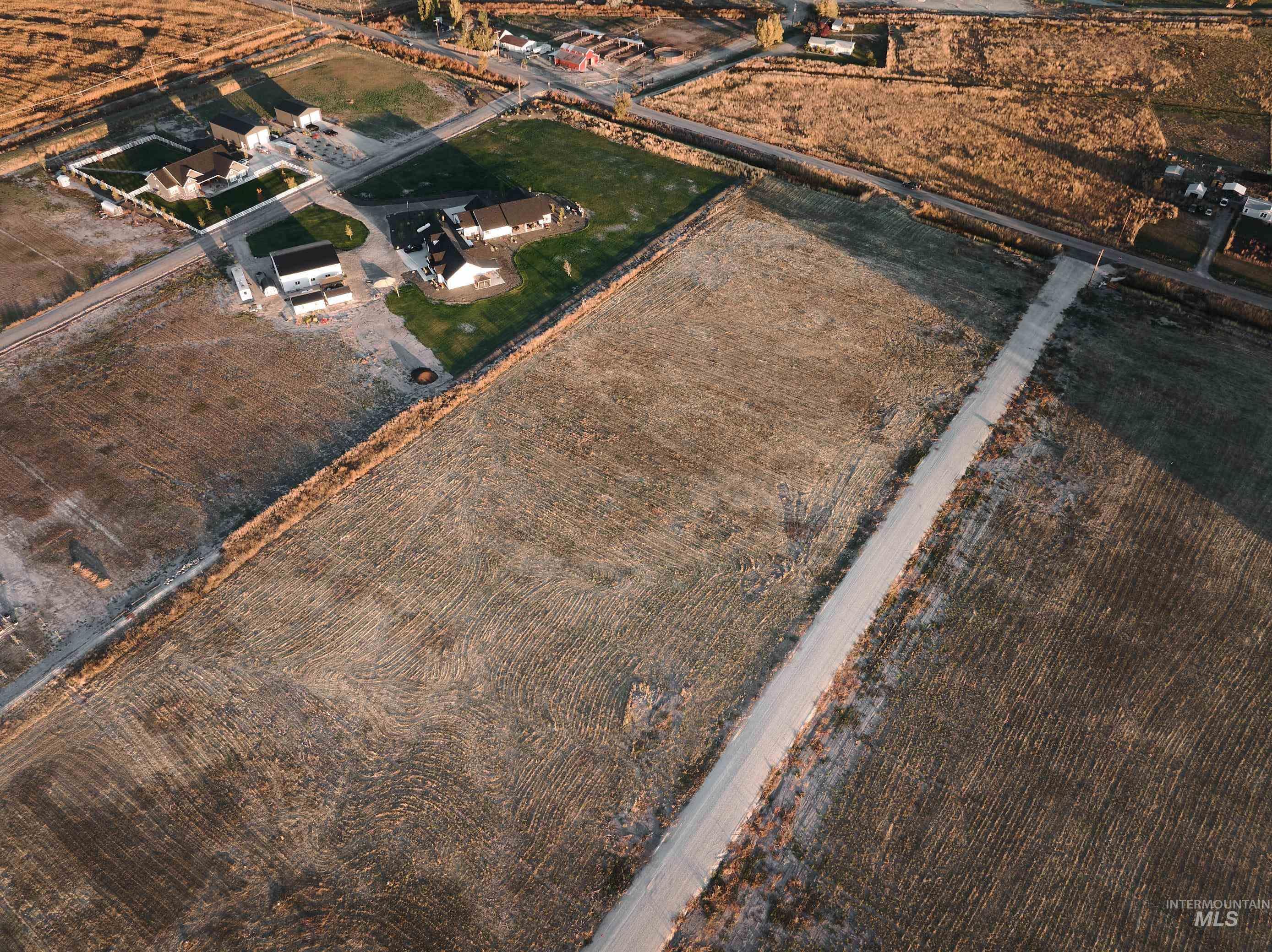 Aerial view of property's location with rural landscape and abundant farmland