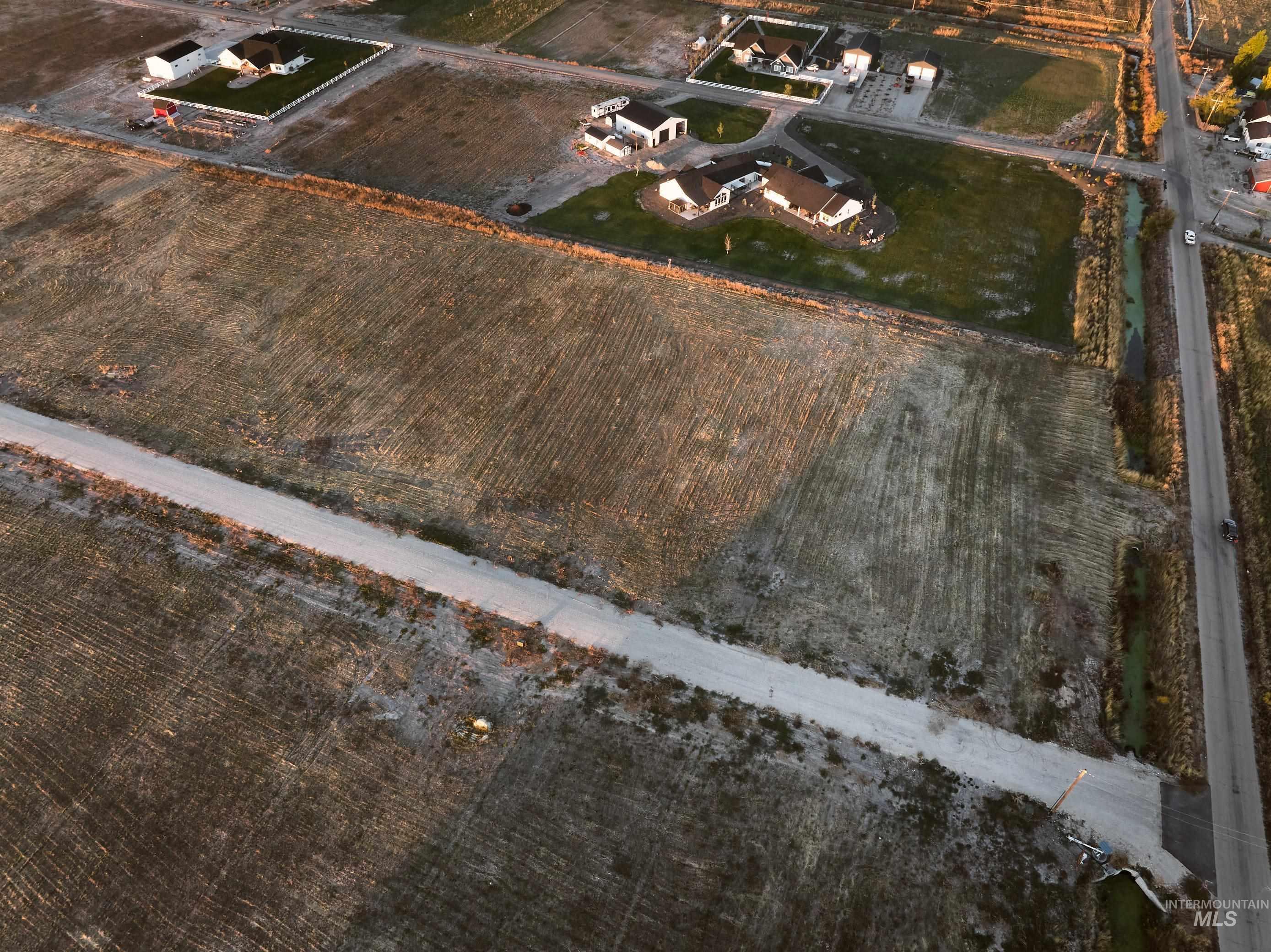 Aerial view of property and surrounding area with rural landscape and extensive farmland