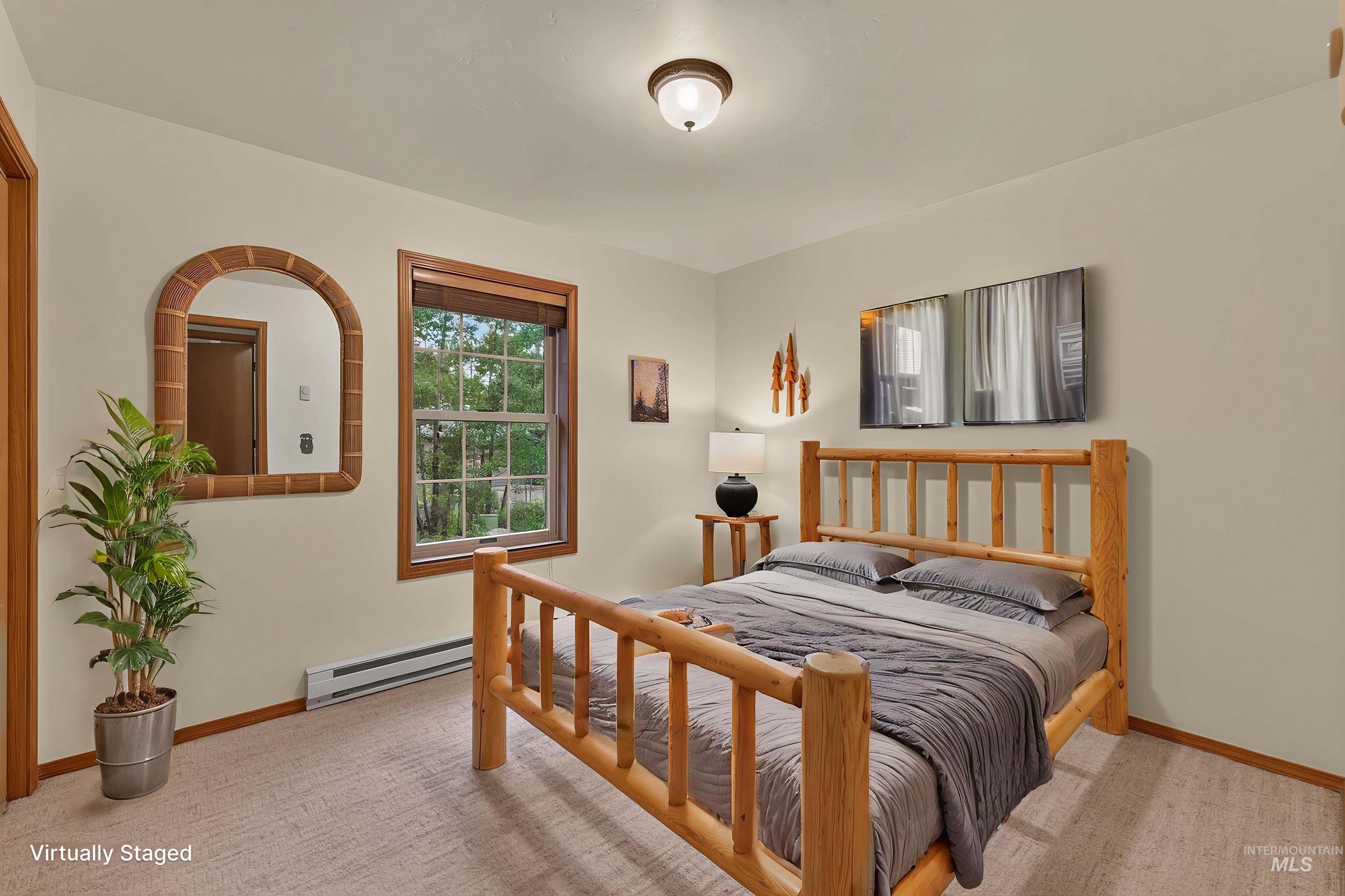 Interior room featuring a window with wood trim, wall-to-wall carpeting, and a ceiling-mounted light fixture