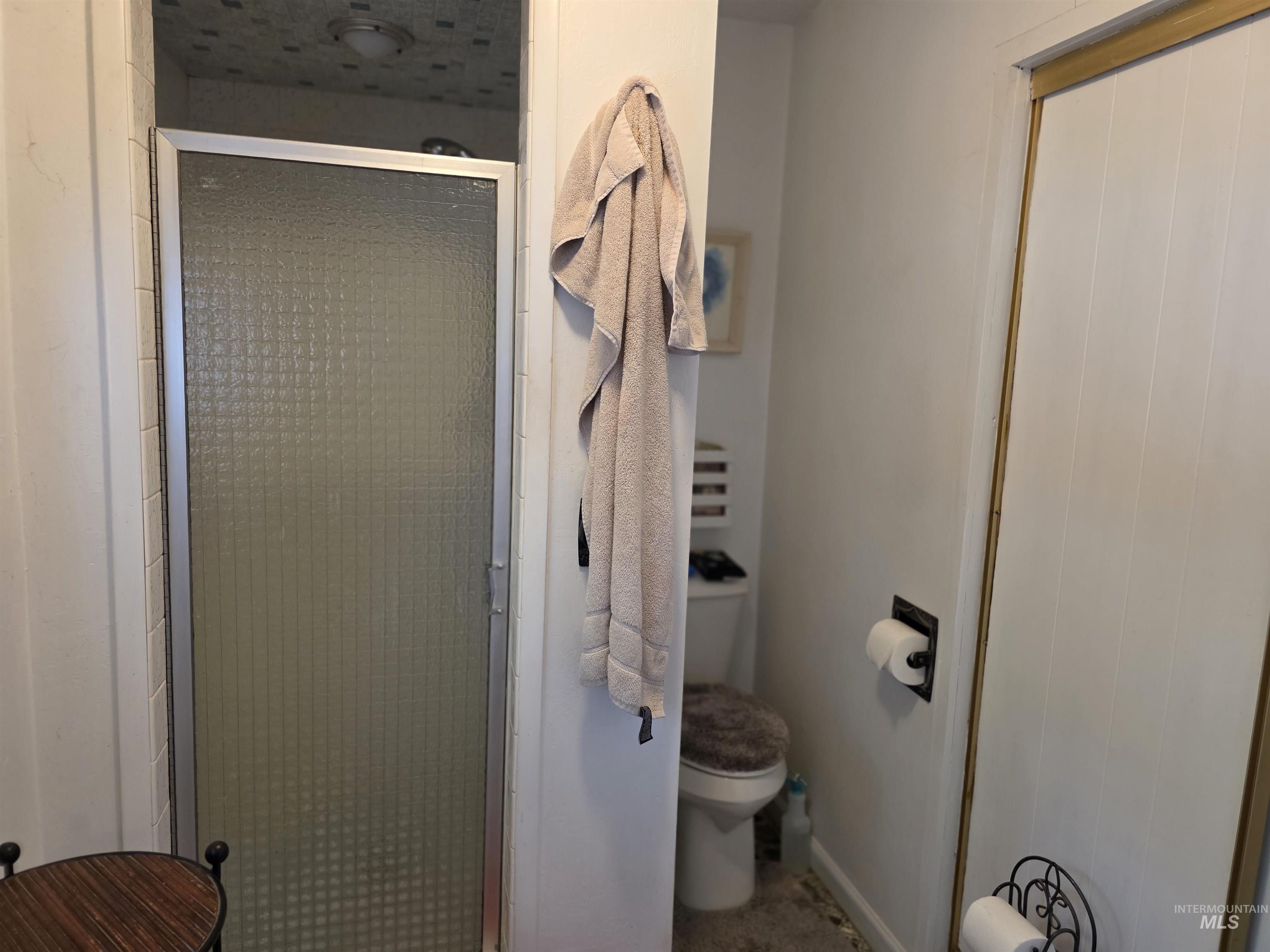 Full bathroom with a shower stall
