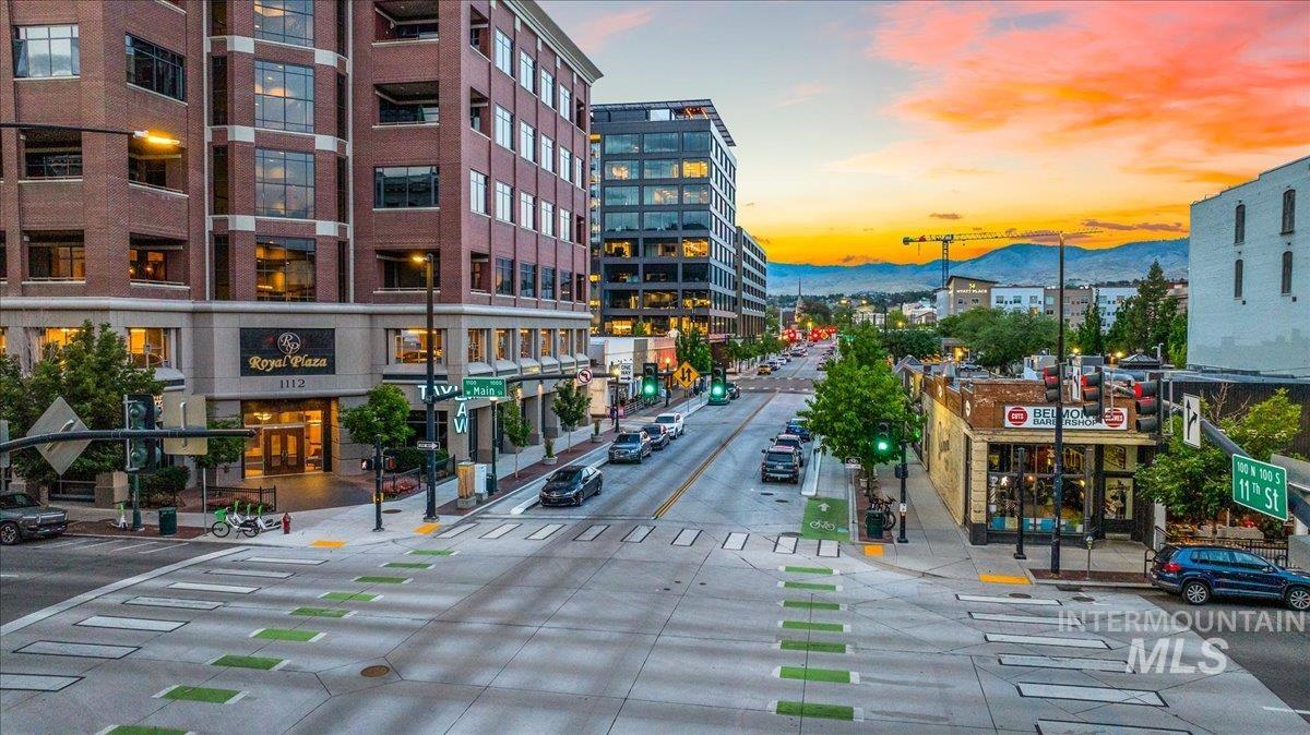 Property at dusk featuring a mountain view