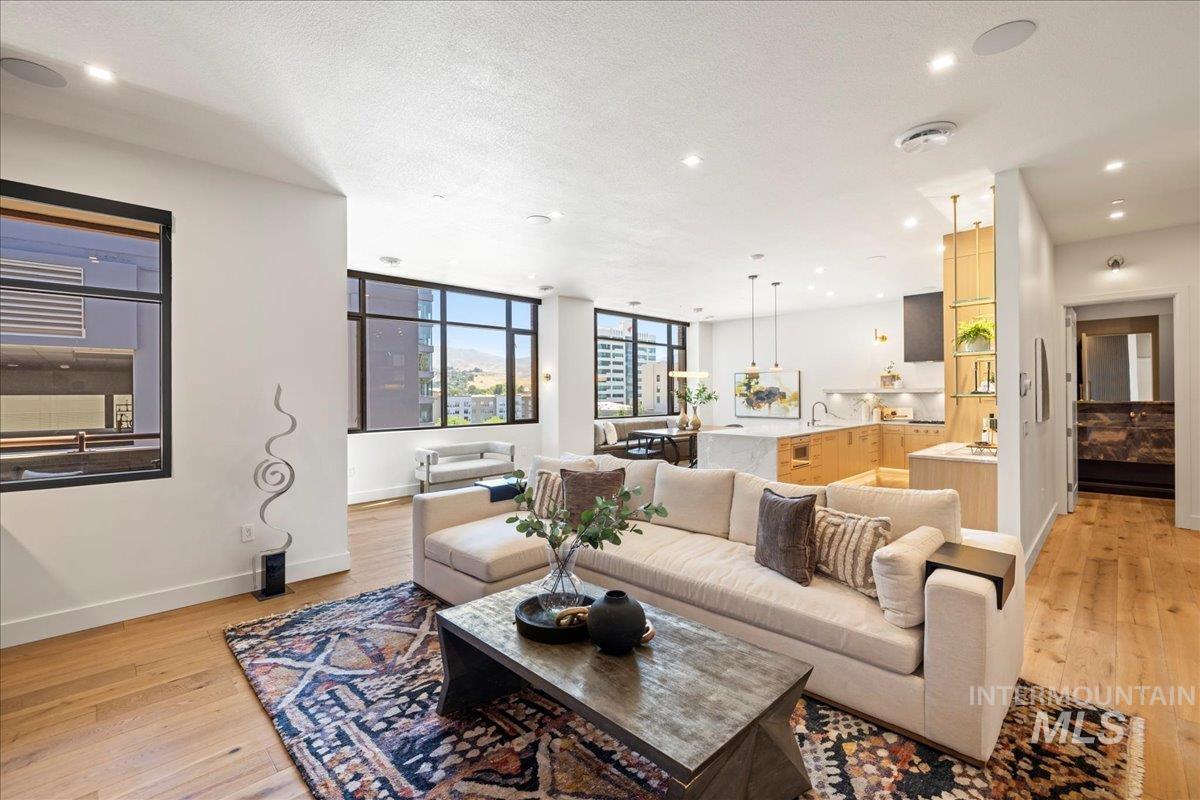 Living room featuring light wood-type flooring and recessed lighting