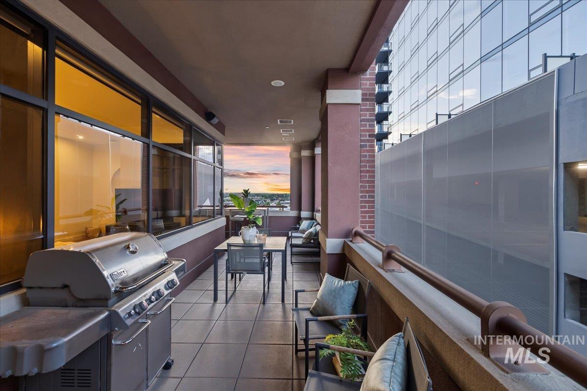 Balcony featuring area for grilling