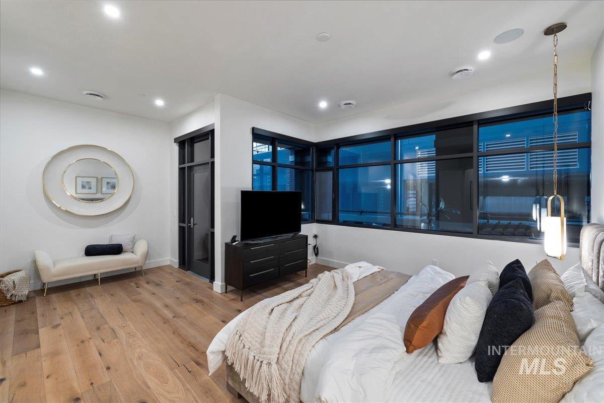 Bedroom featuring wood finished floors and recessed lighting