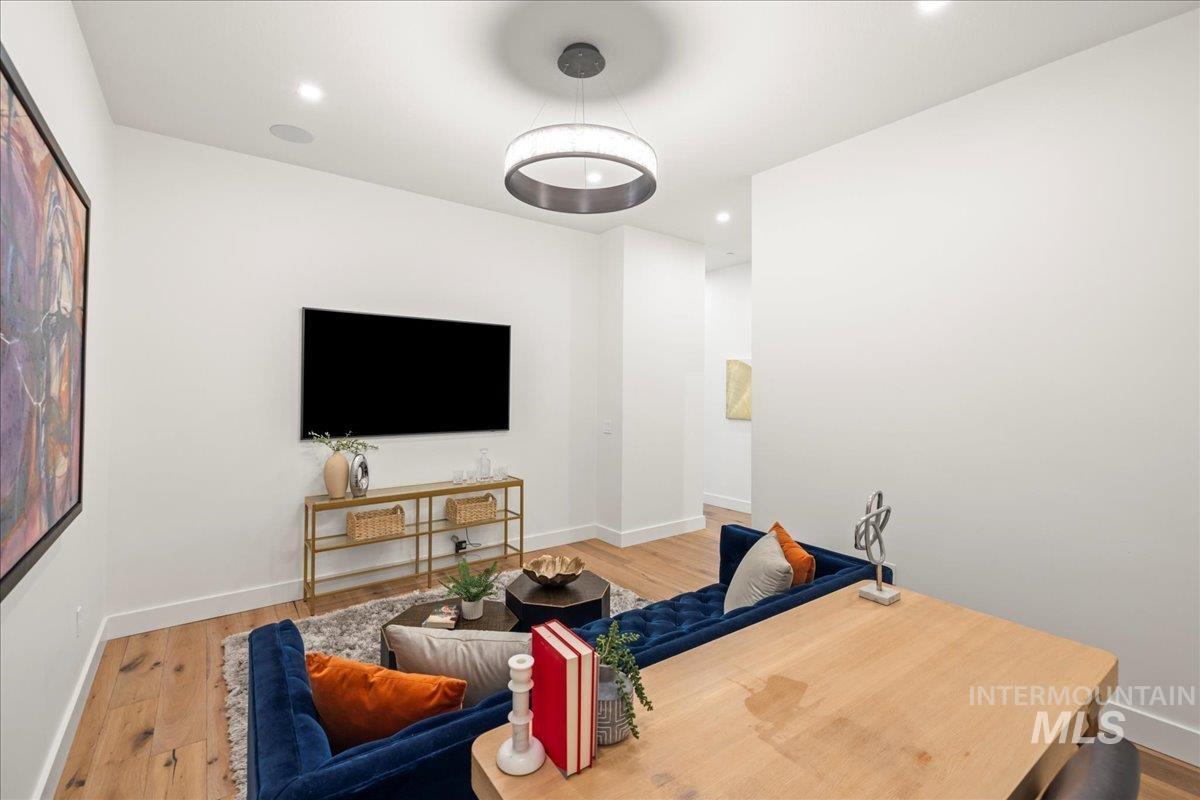 Living room featuring wood finished floors and recessed lighting