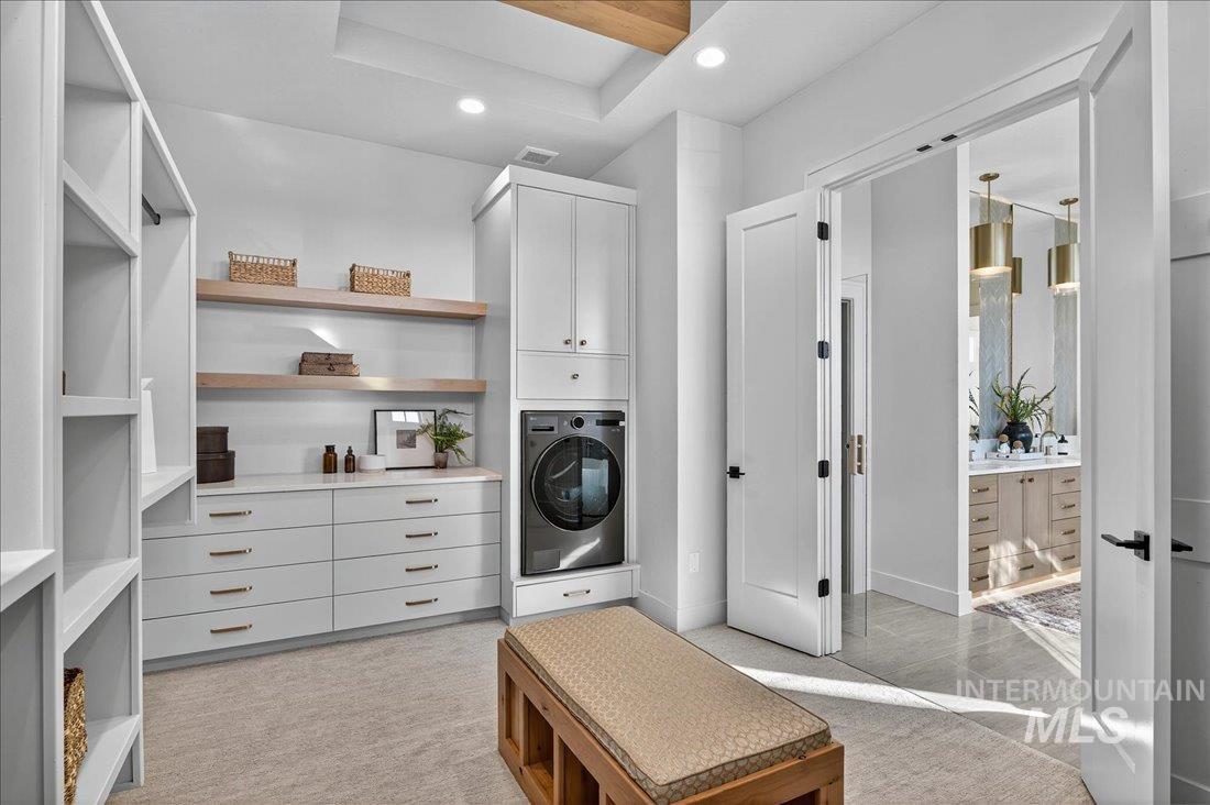 Laundry room with washer / dryer, recessed lighting, and light colored carpet