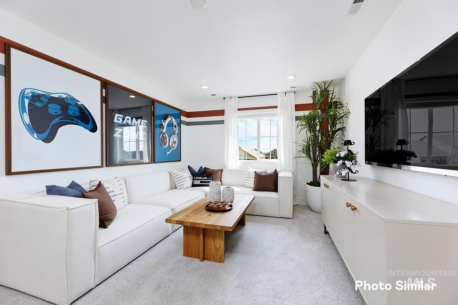 Living room featuring light carpet and recessed lighting