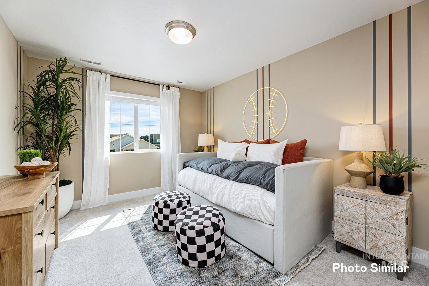Bedroom with carpet flooring and baseboards